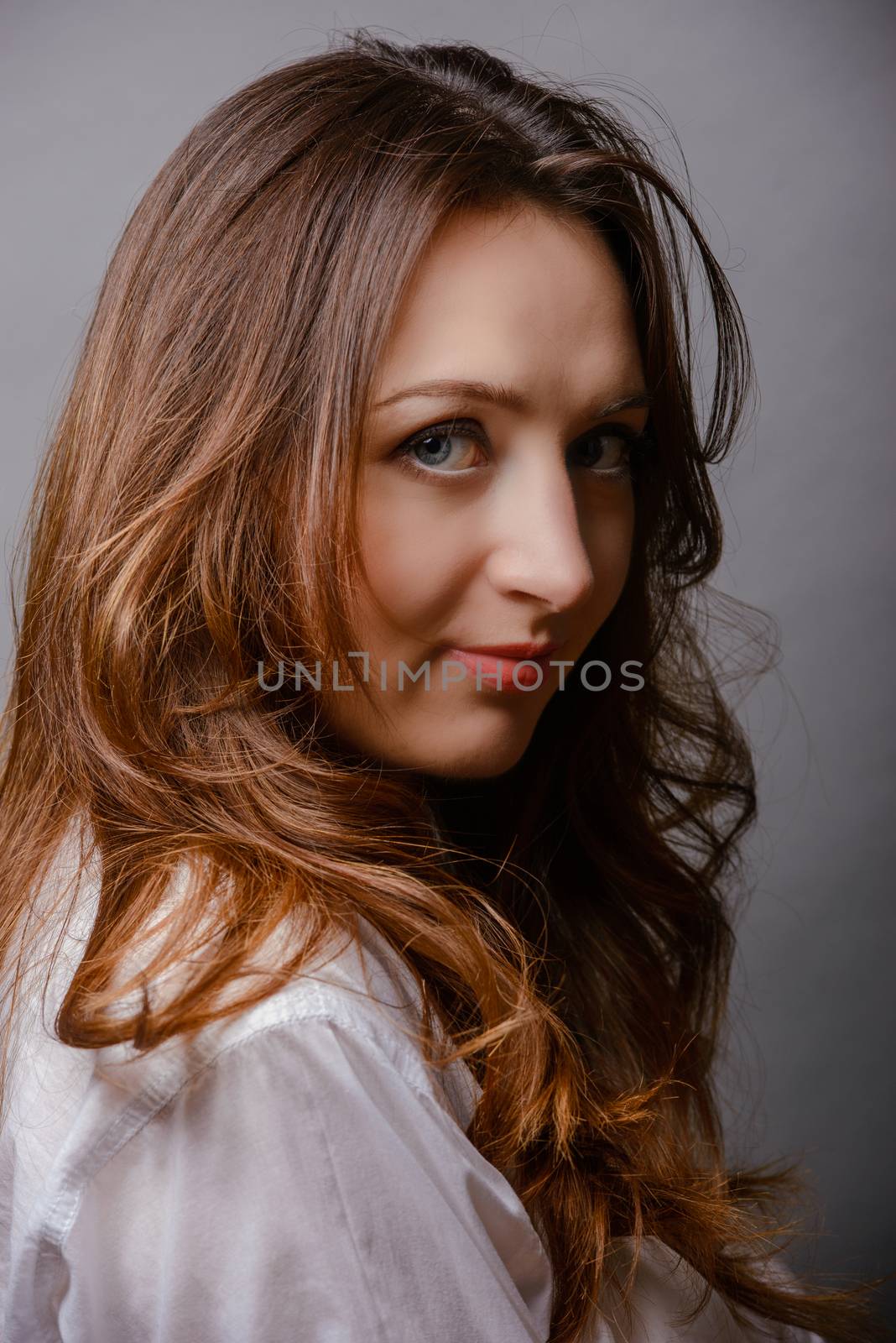 young beautiful brunette woman portrait in studio