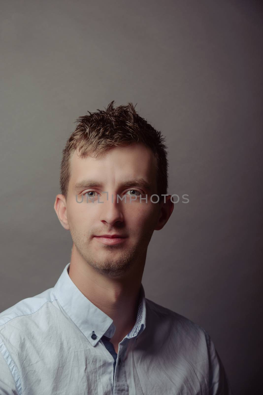 Portrait of a smart serious young man.