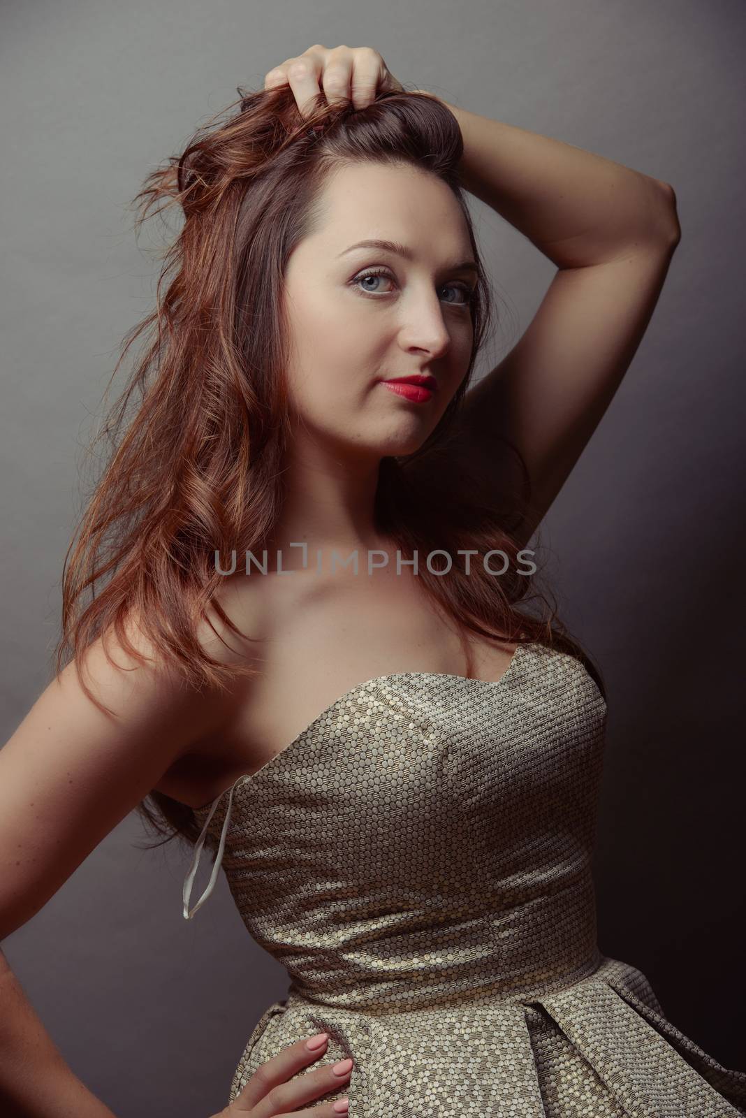 A brunet sexy girl posing in studio
