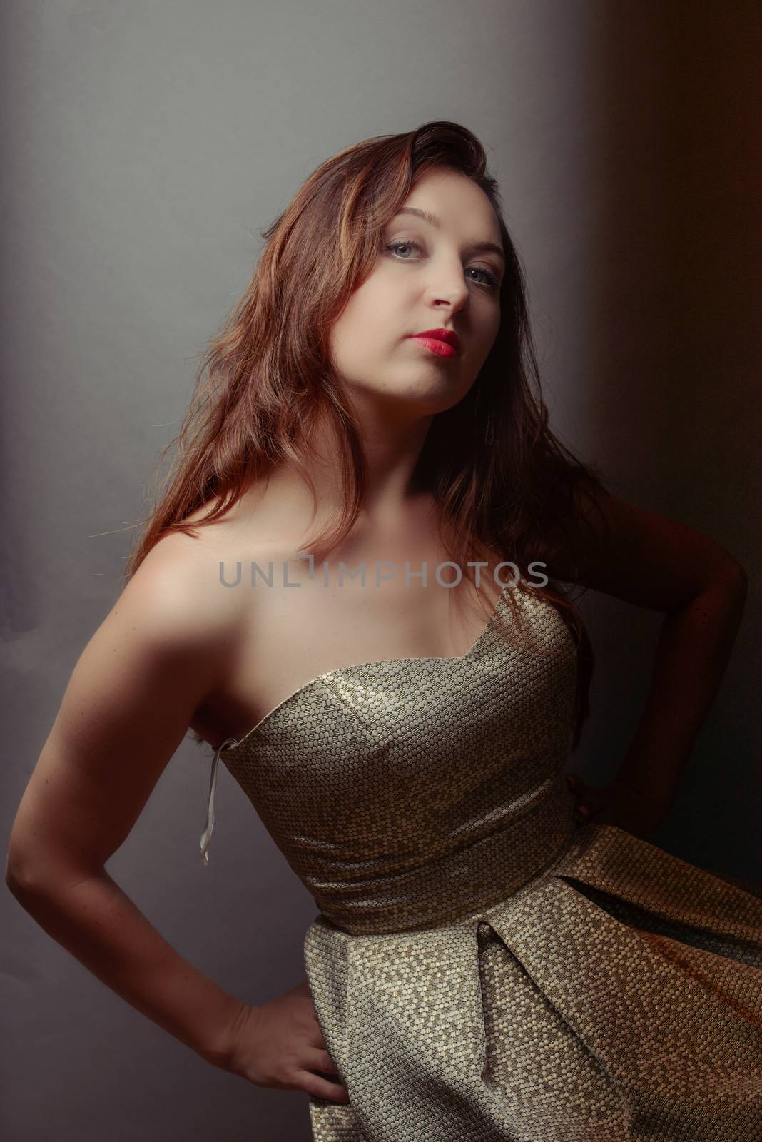 A brunet sexy girl posing in studio