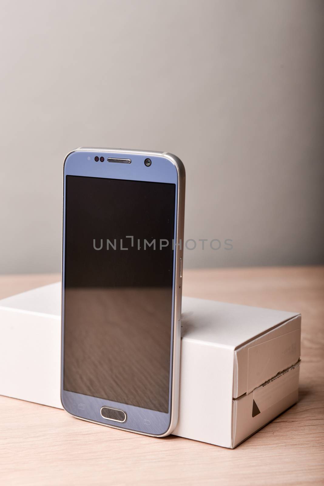 Perfectly detailed modern smart phone on a desk