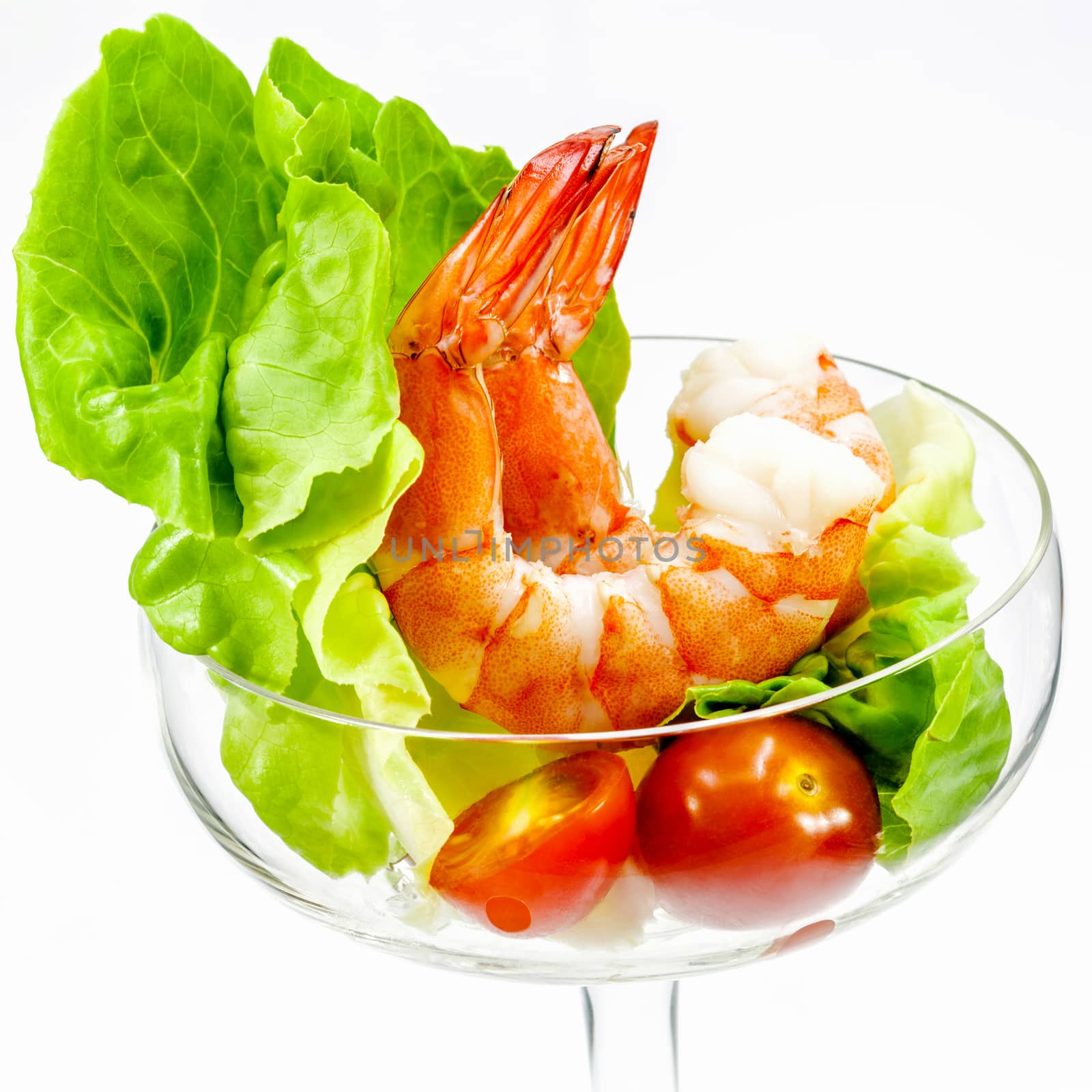 Fresh steamed  prawns with vegetable salad isolate on white background. Boiled , shrimp with mixed green salad . Selective focus depth of field.