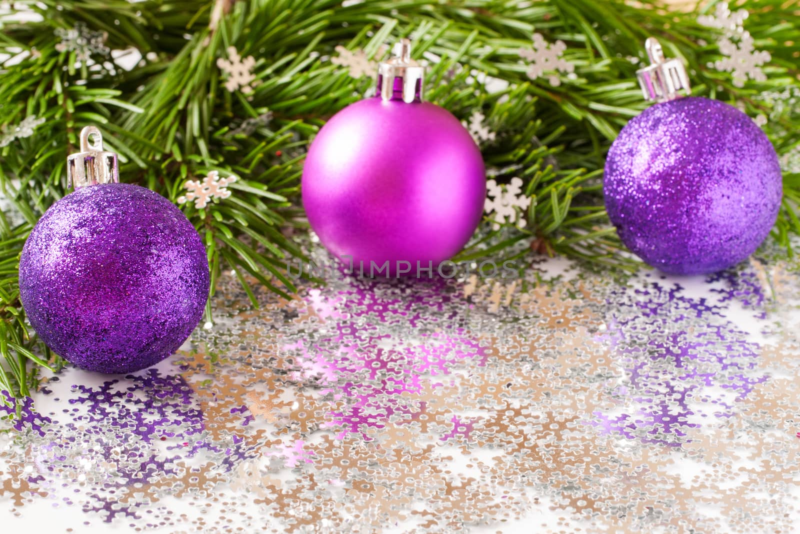 fir tree branch and Christmas toys bauble and snow flares confetti with copy space