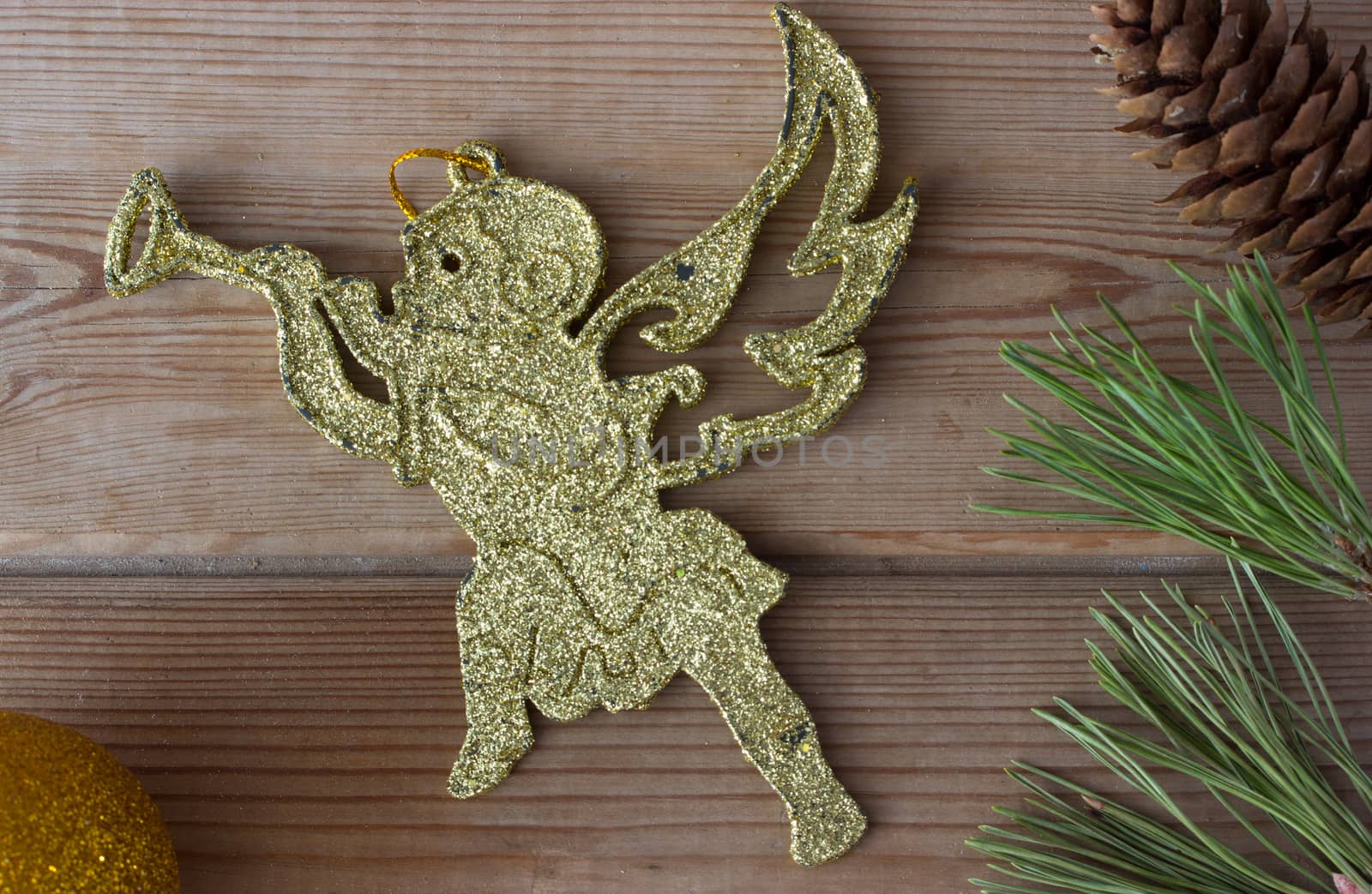 golden cherub and Christmas tree branches by liwei12