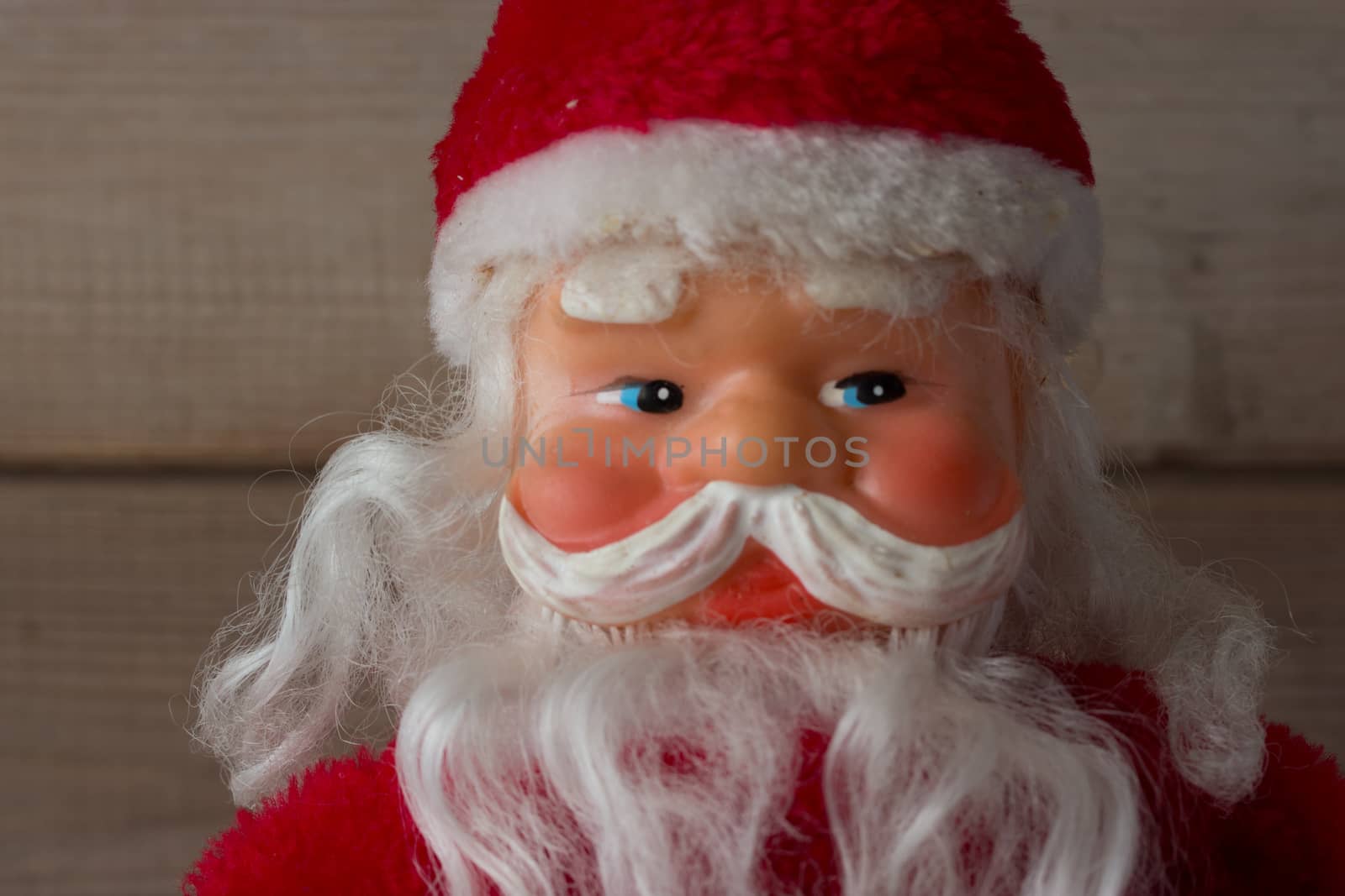 face of Santa Claus with candle doll