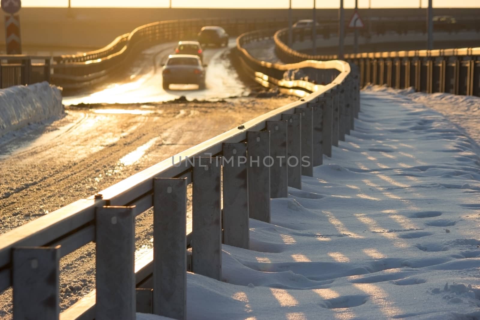 winter road with fence, distant car by liwei12