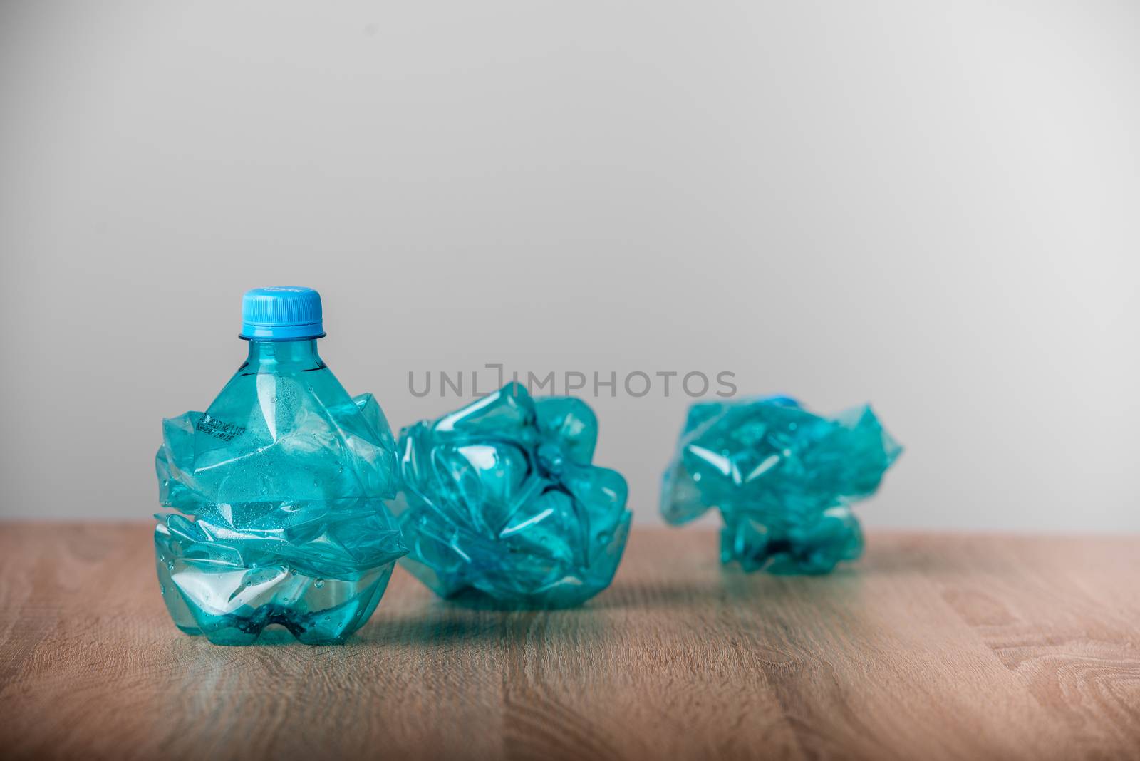 set of blue empty plastic water bottles