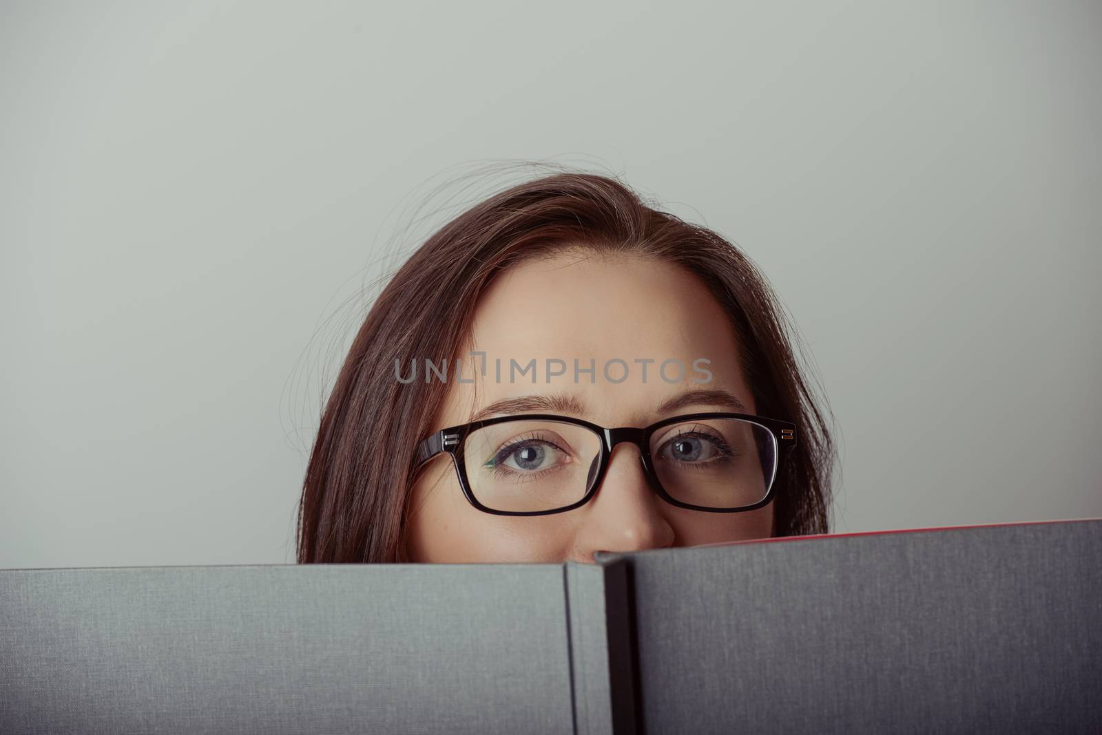 Business woman holding a wide open book