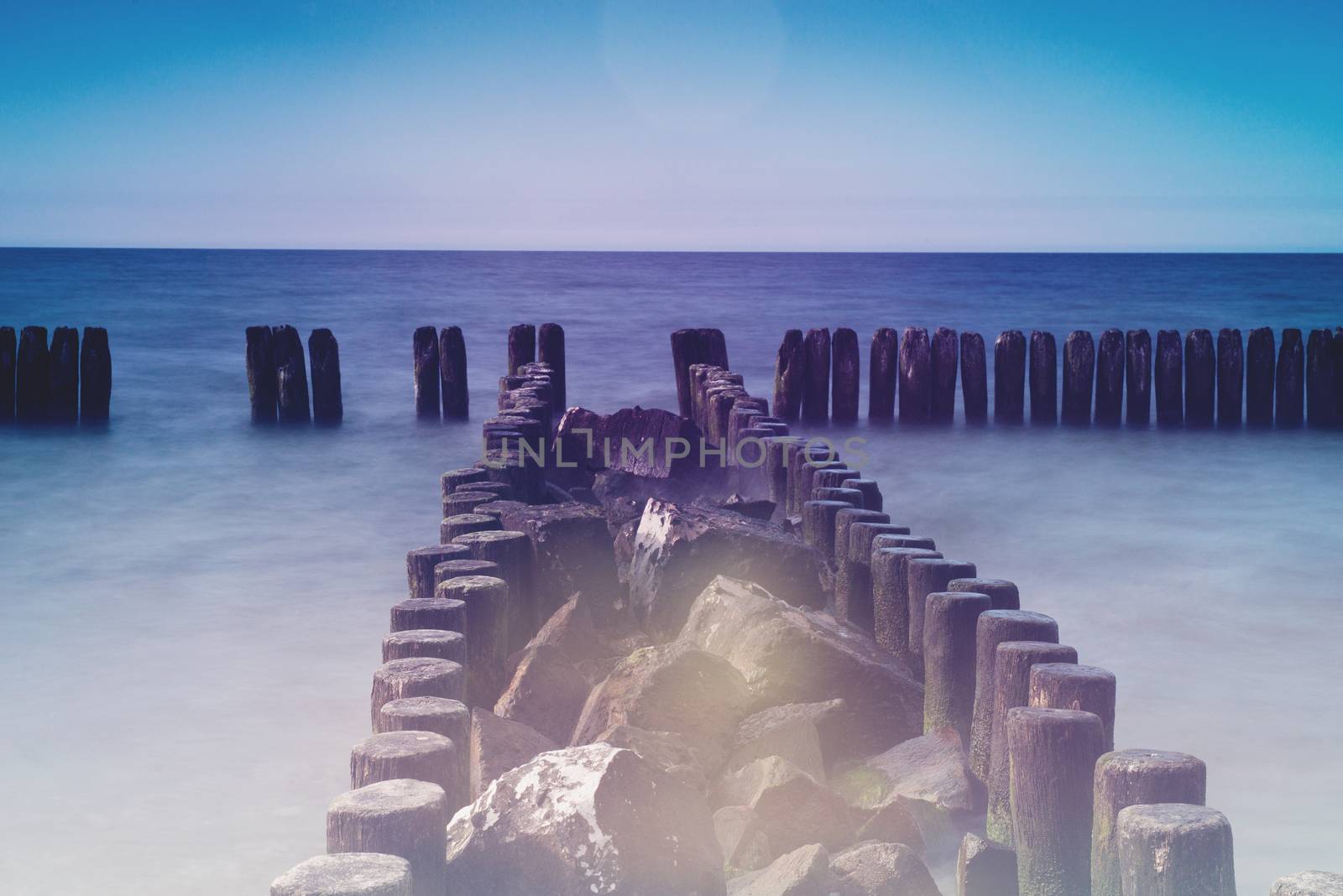 Breakwaters in the Baltic Sea at sunset