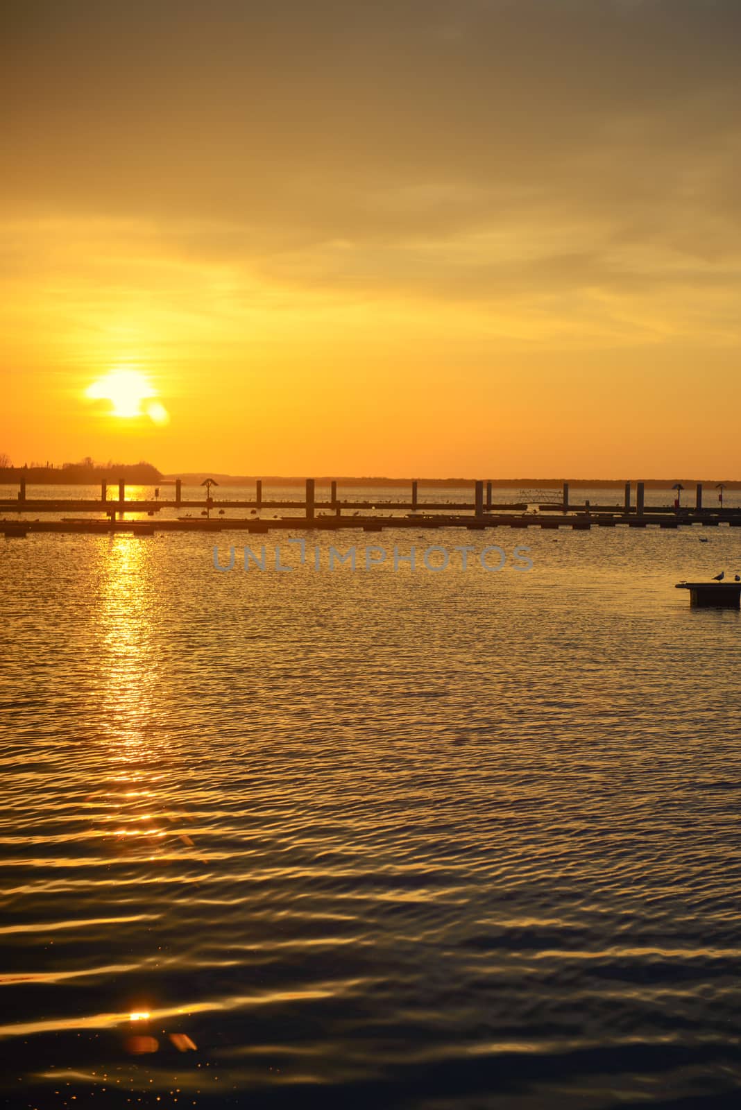 Yacht port over beautiful orange sunset in summer time