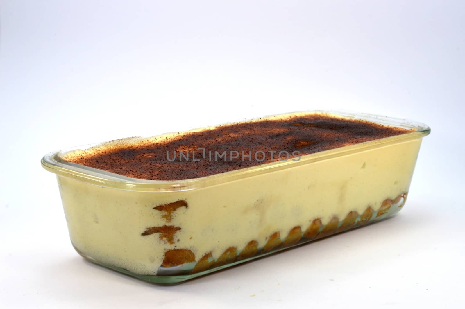 tiramisu dish in clear glass on white background