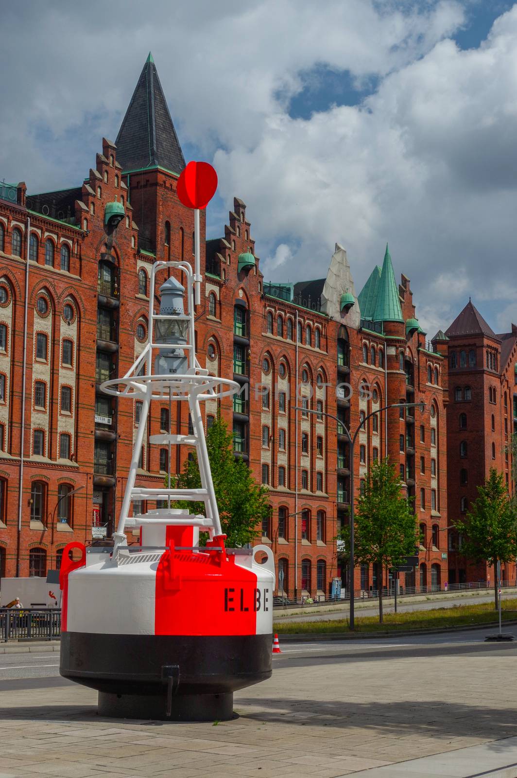 HAMBURG, GERMANY - JULY 18.2016: Famous Speicherstadt warehouse district with a buoy by evolutionnow