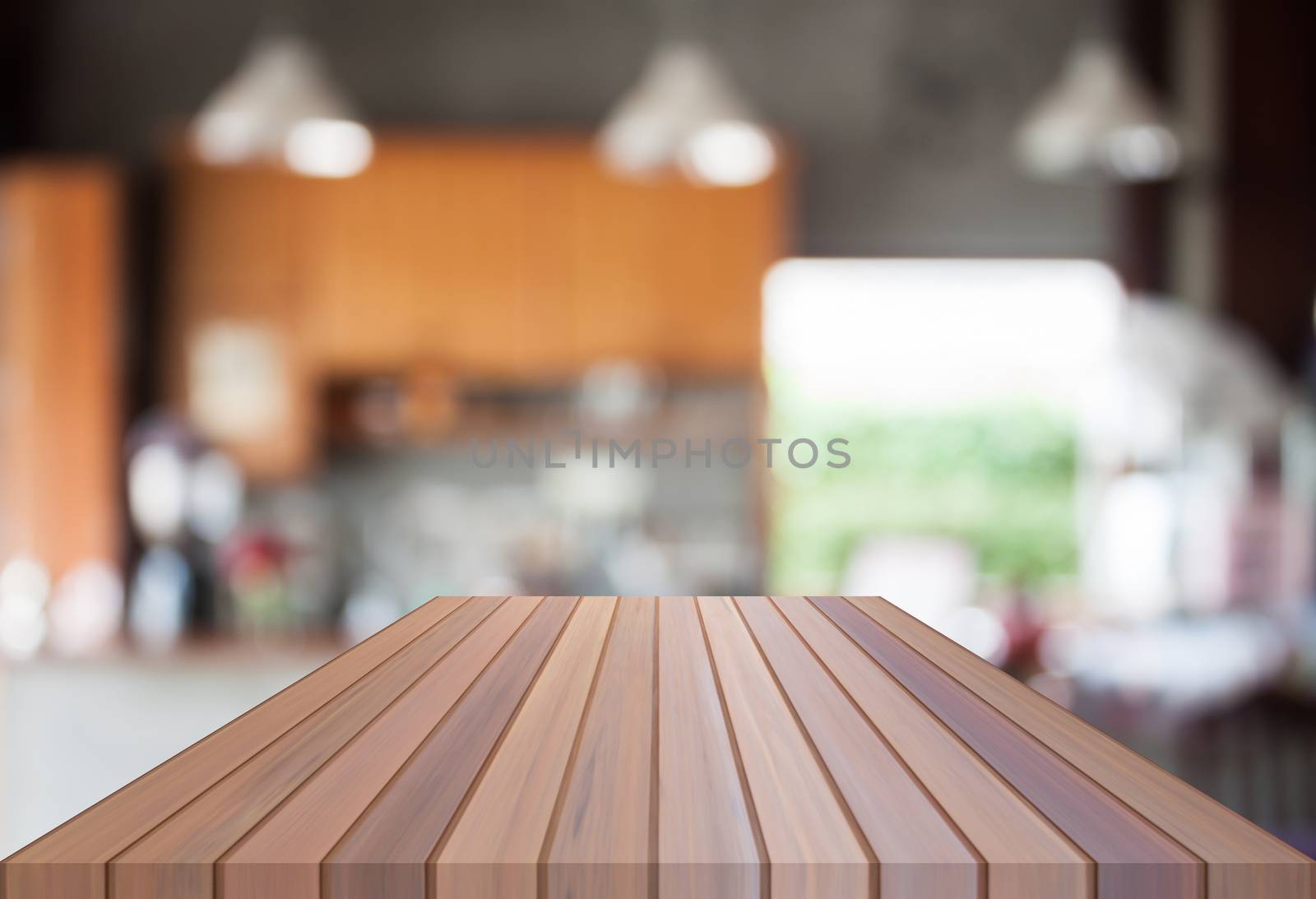 Abstract blur coffee shop with empty wooden top by punsayaporn