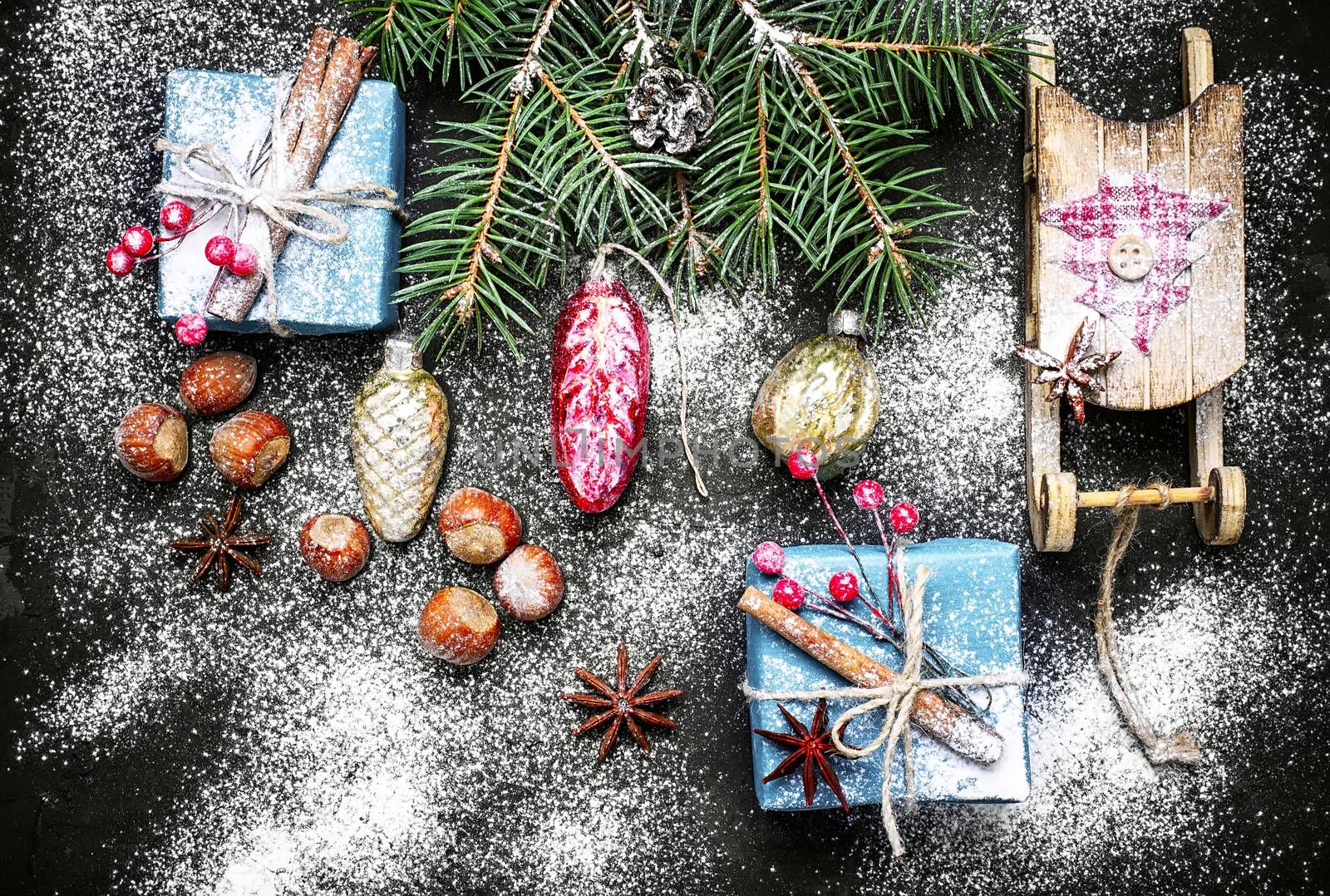 Box with Christmas present and Santa Claus sledge