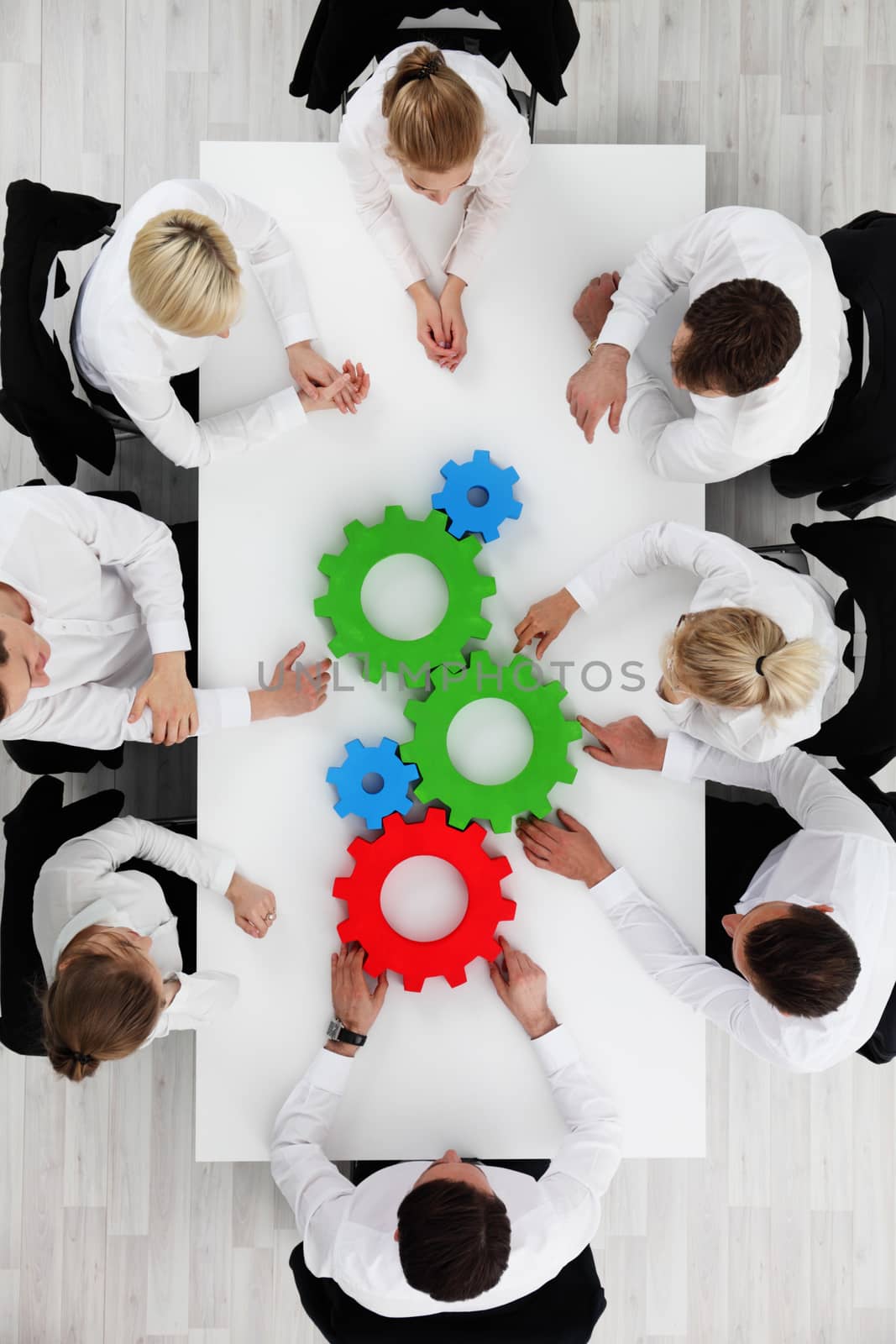 Business team with cogs by ALotOfPeople