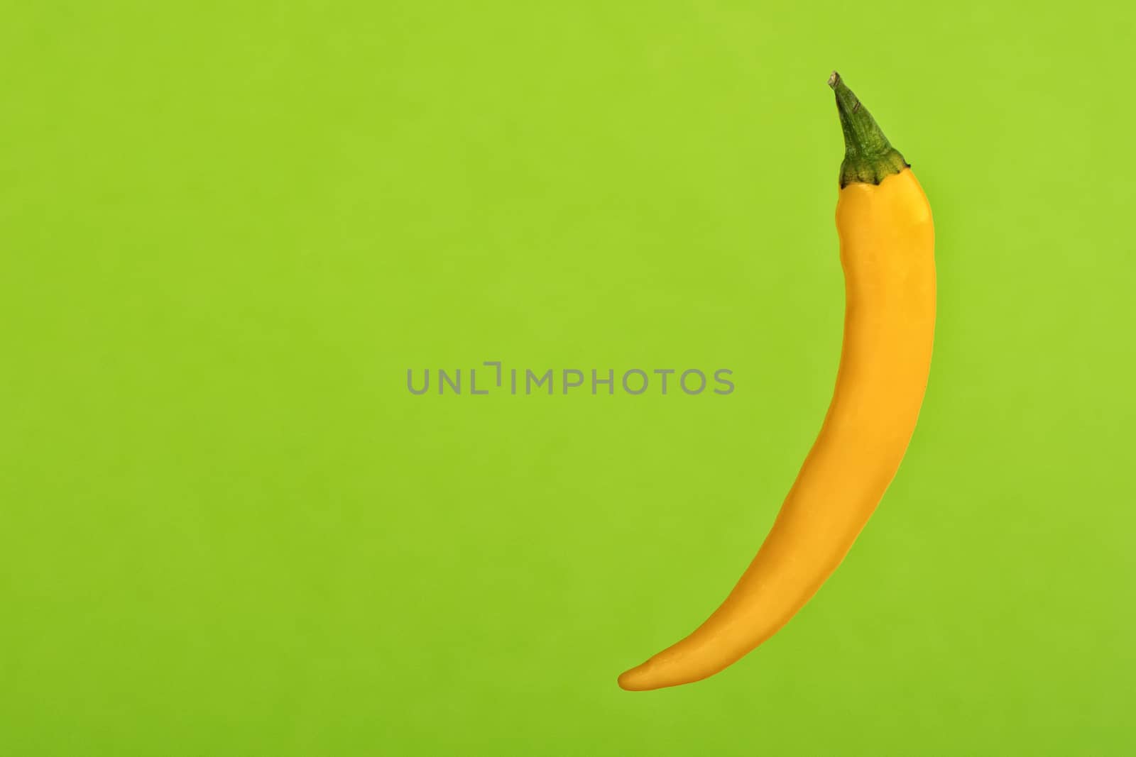 Red Chilli isolated on a green background