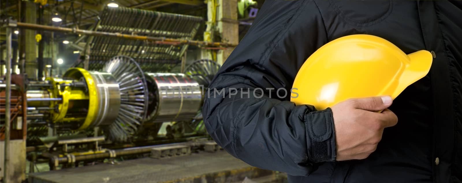 Worker with safety helmet at industrial factory