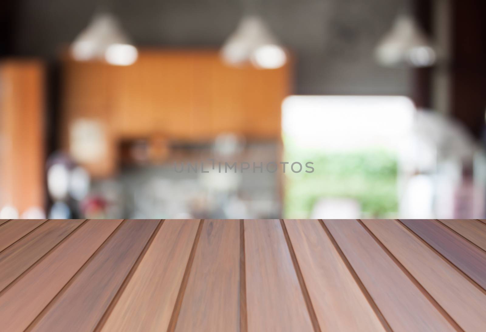 Abstract blur coffee shop background with empty table top by punsayaporn
