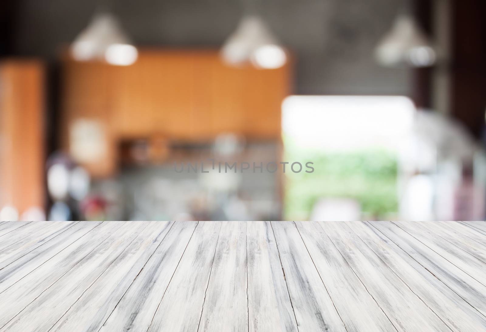 Abstract blur coffee shop background with white empty table top by punsayaporn