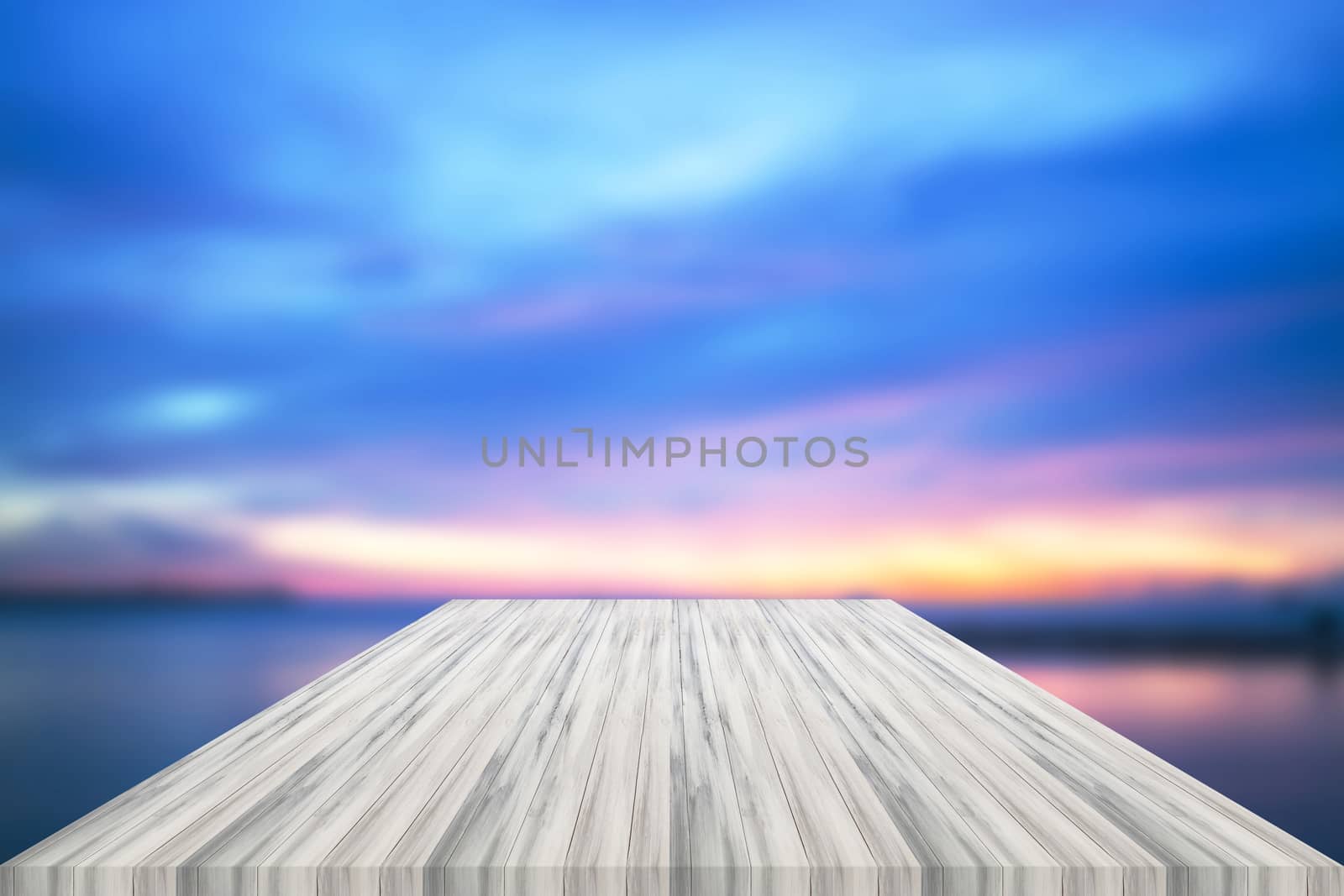 Empty white table top with sunset background by punsayaporn