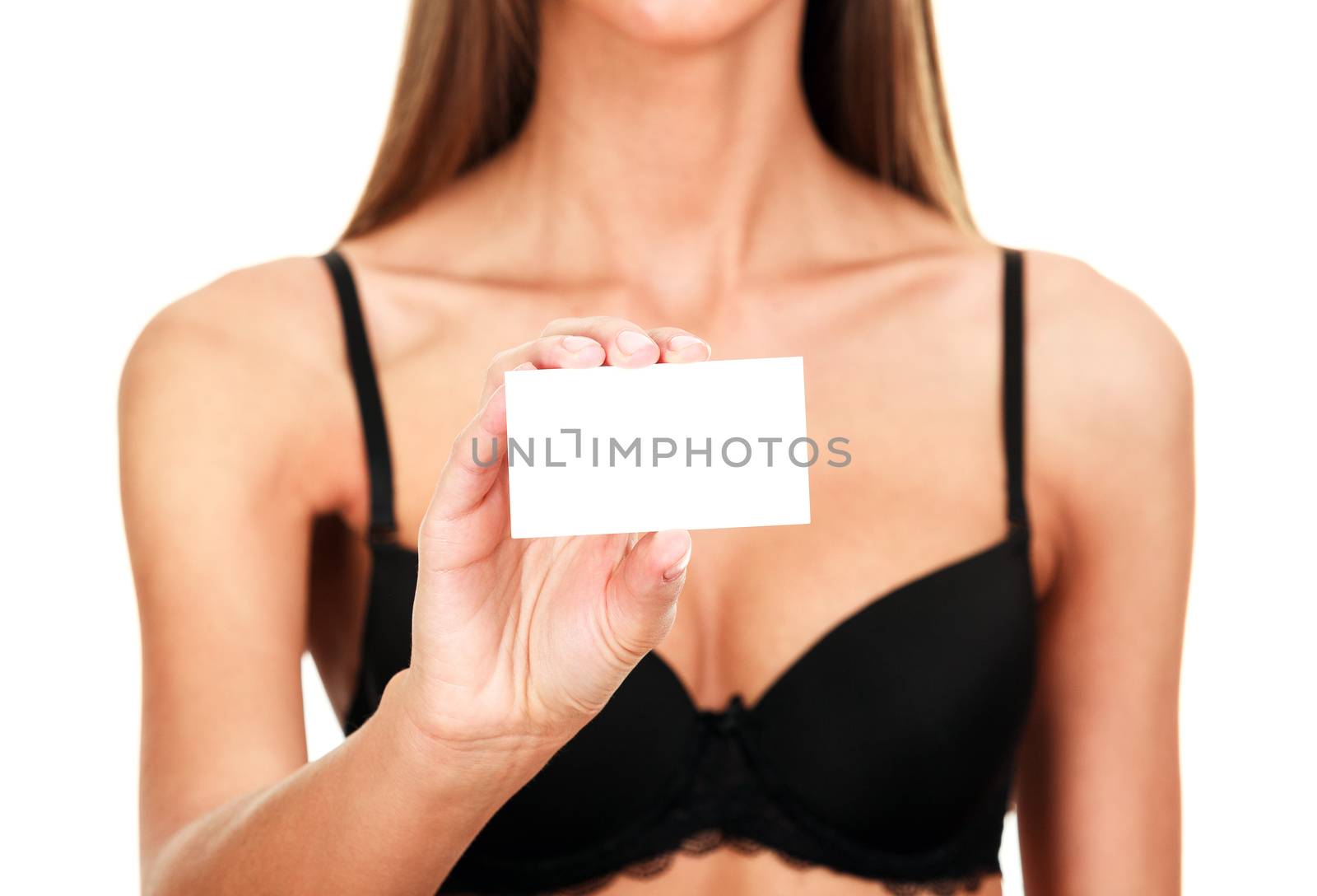 Woman in black bra shows empty card, isolated on white background