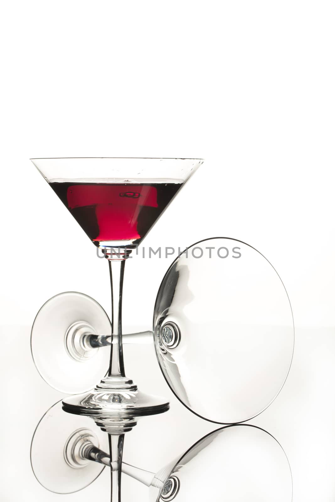 Wineglasses on glass reflecting background