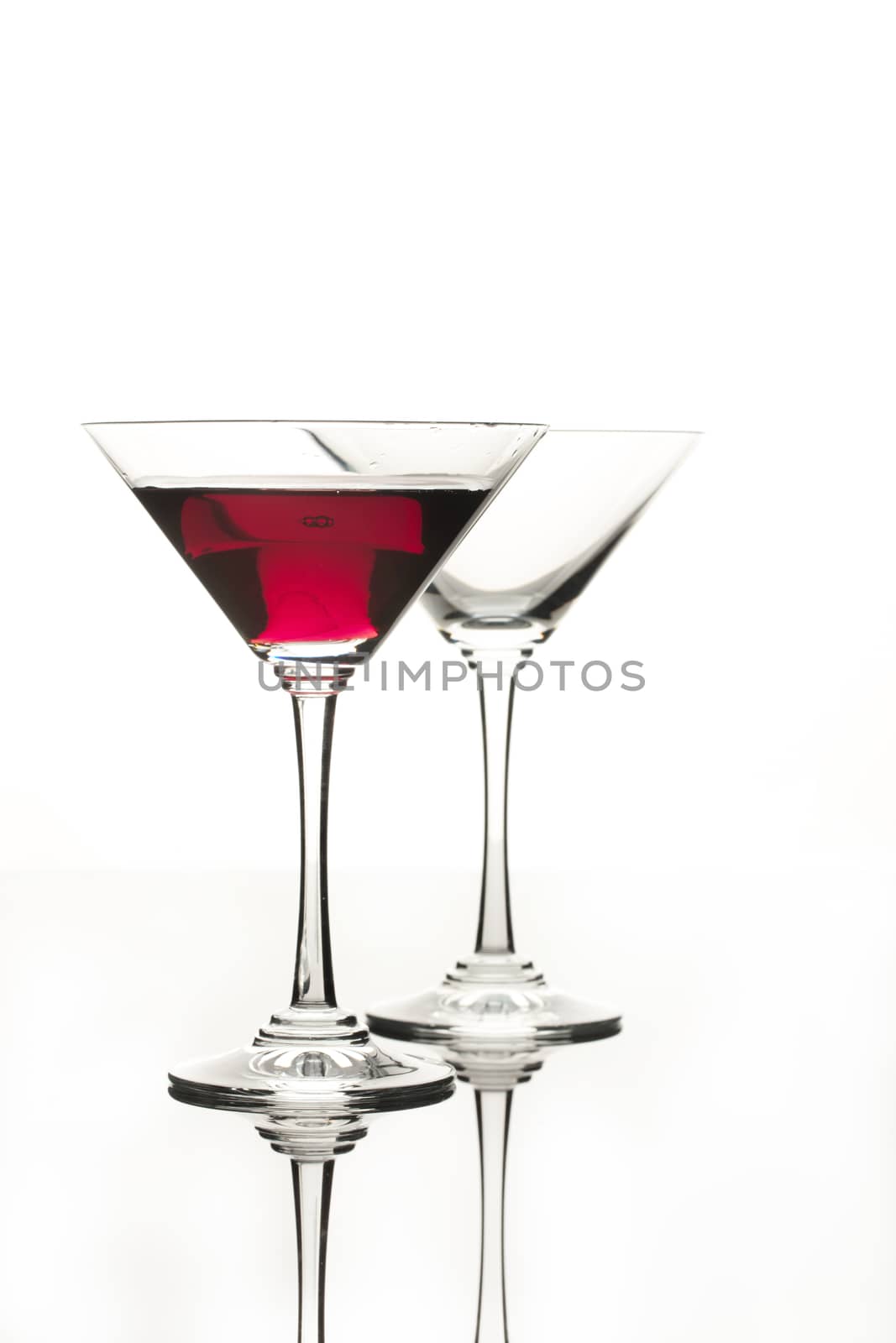 Wineglasses on glass reflecting background