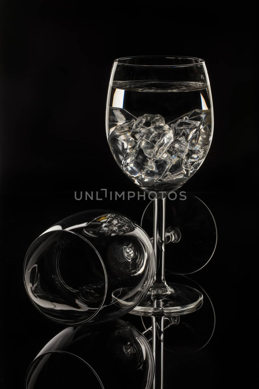 Wineglasses on glass reflecting background