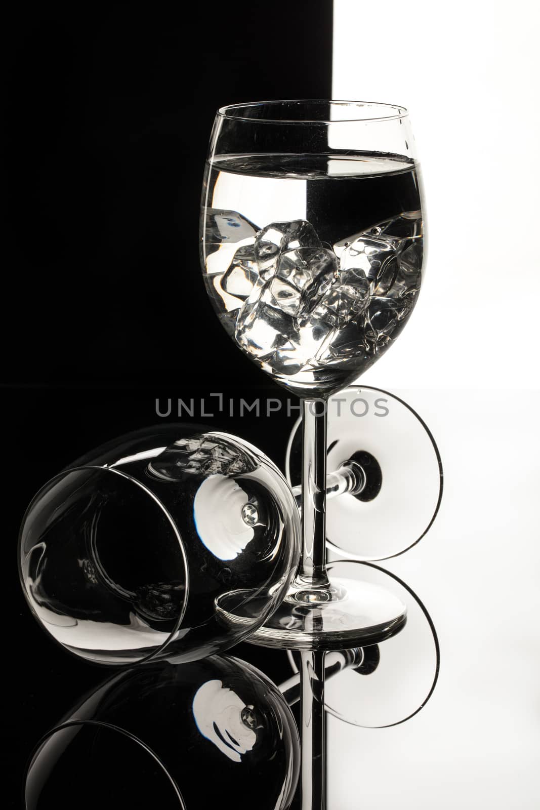 Wineglasses on glass reflecting background