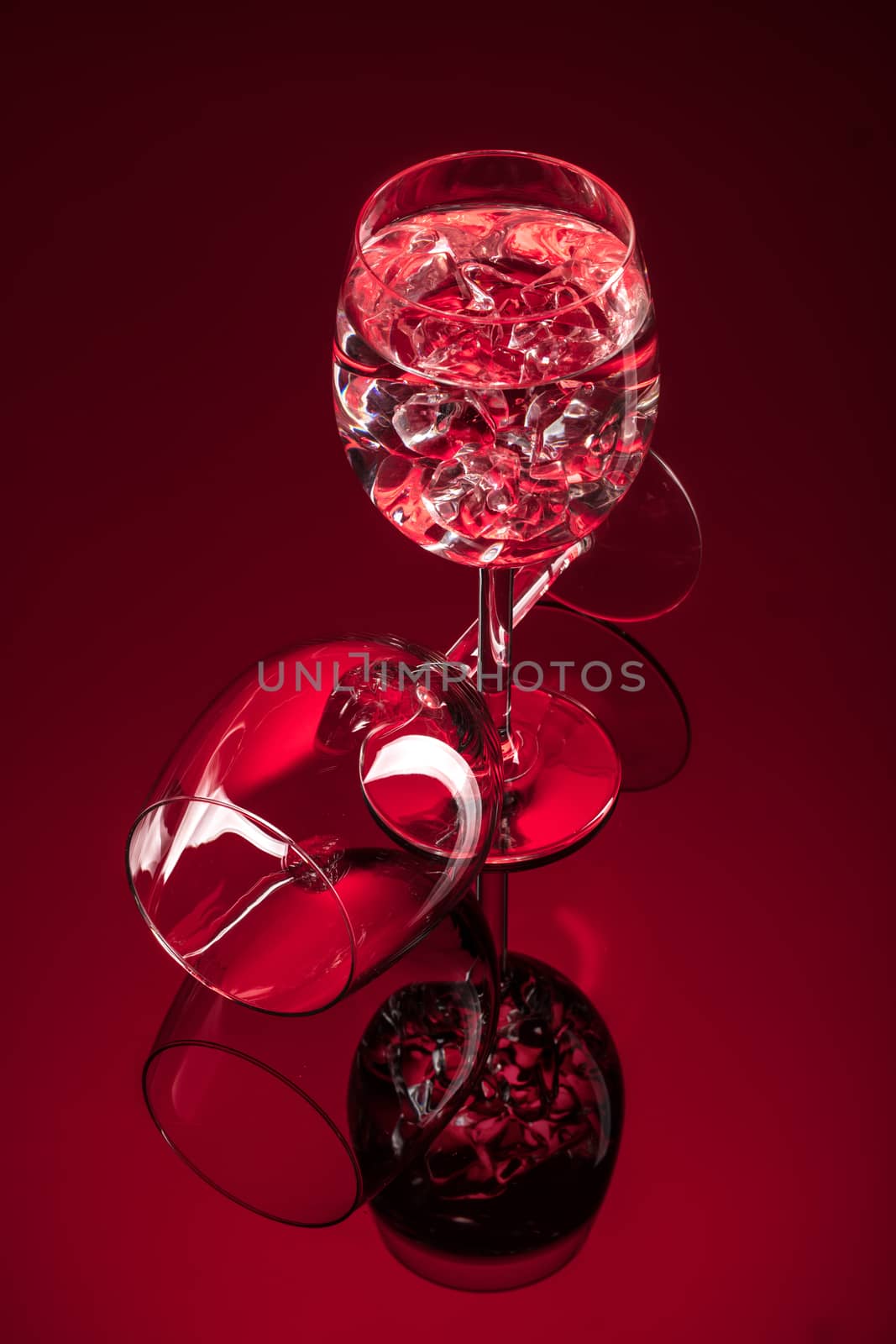Wineglasses on glass reflecting background