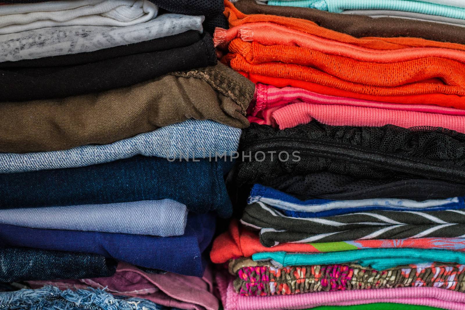 A pile of colorful clothes on white