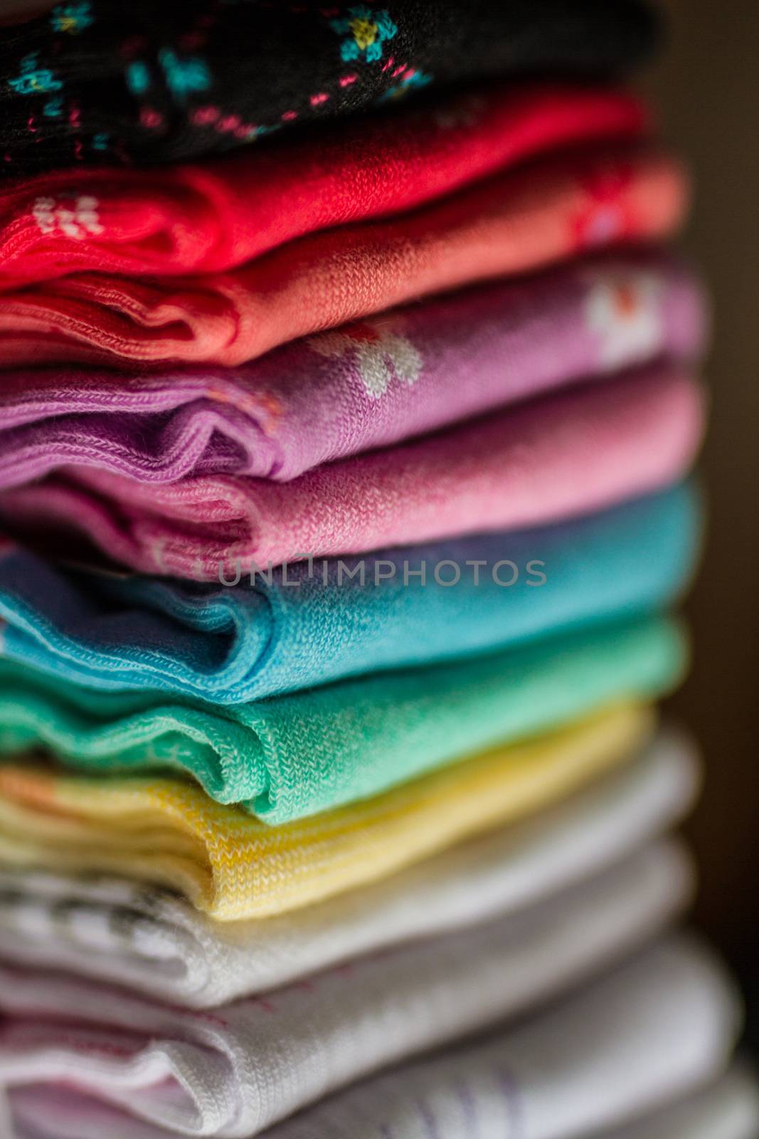A pile of colorful clothes on white