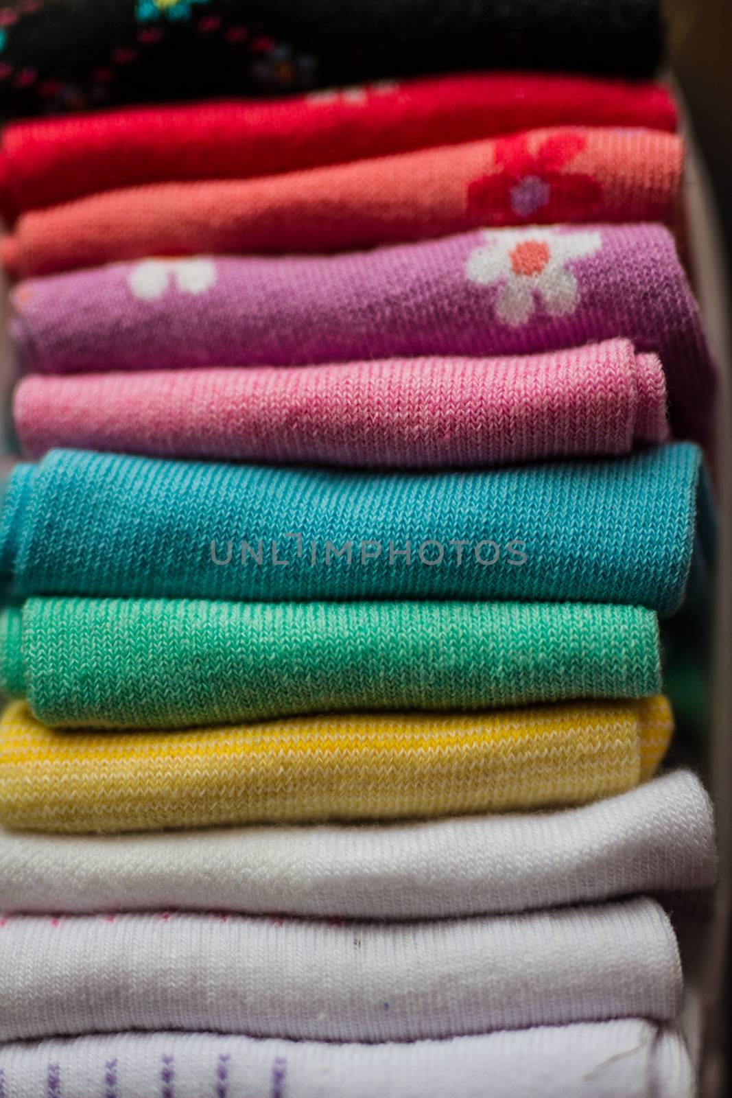 A pile of colorful clothes on white