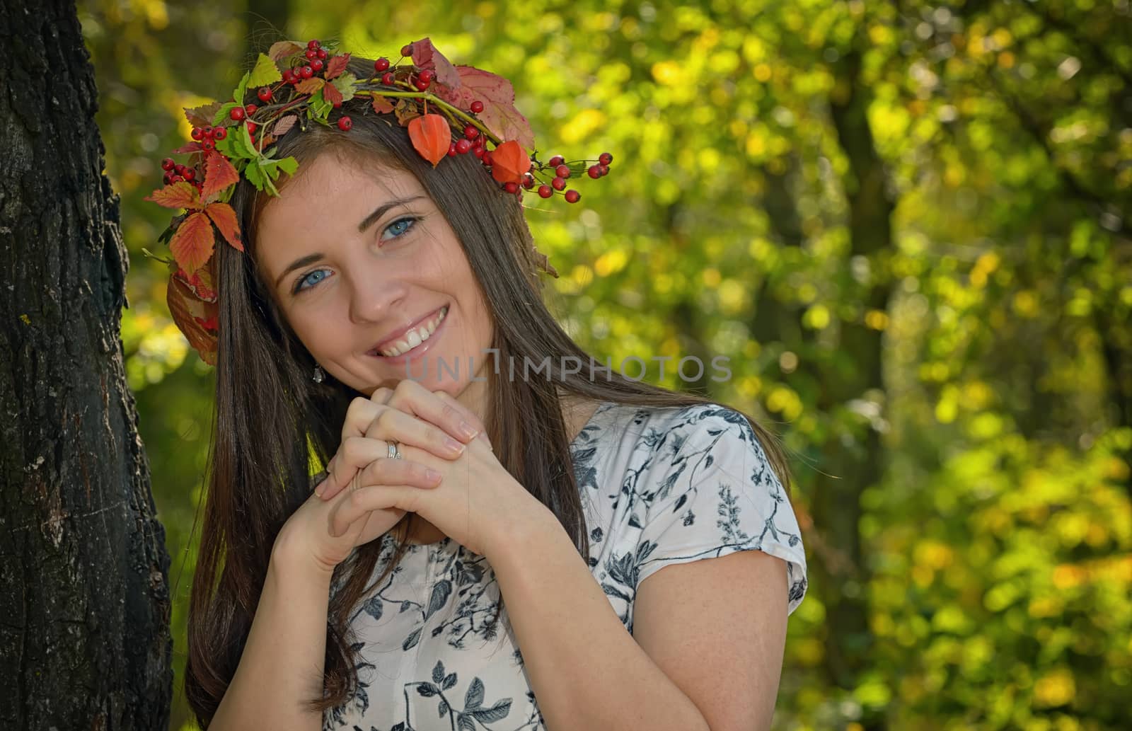 Portrait of girl with autumn wreath