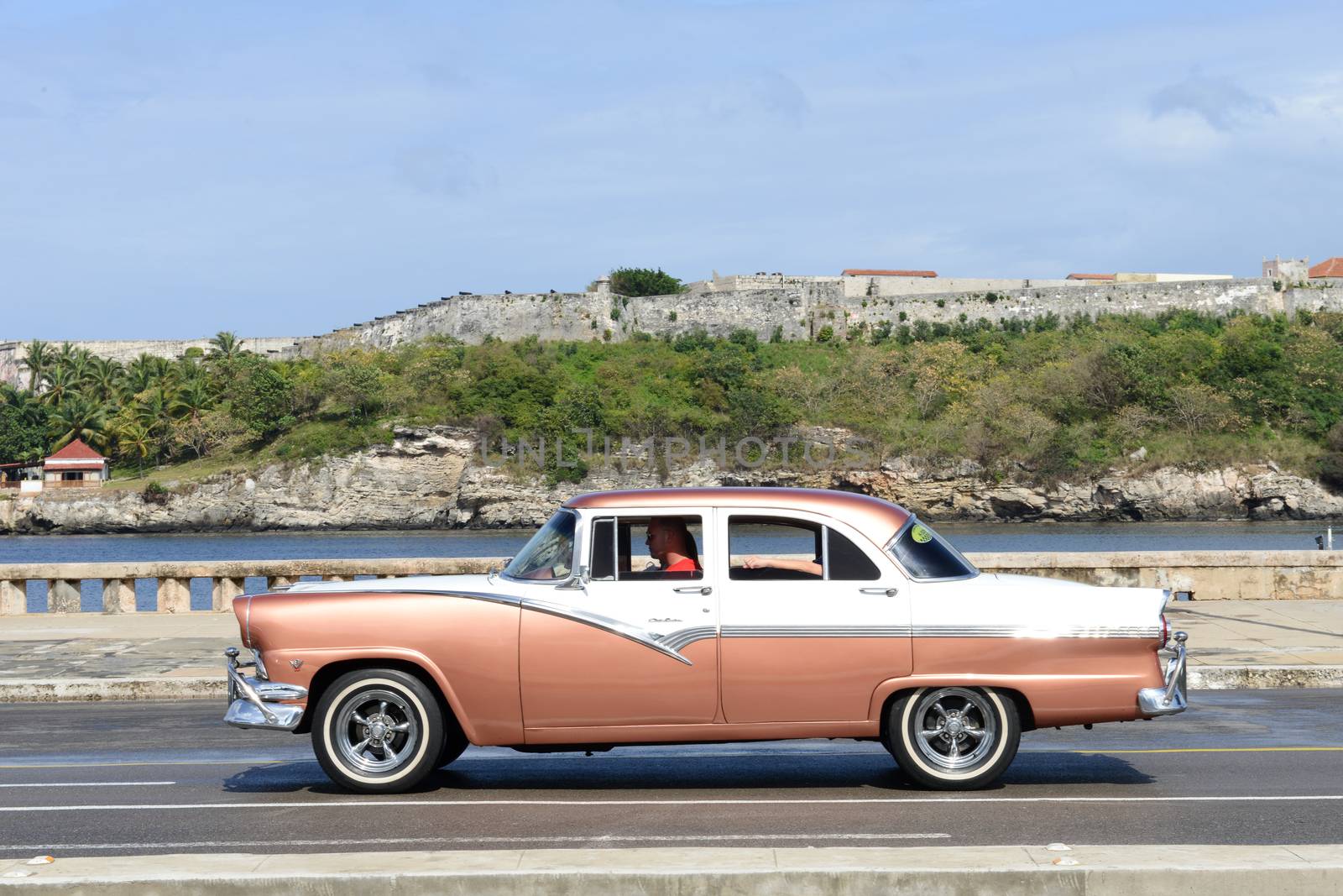 Havana, Cuba - 27 January 2016: Person driving his vintage car at the Malecon in Havana on Cuba