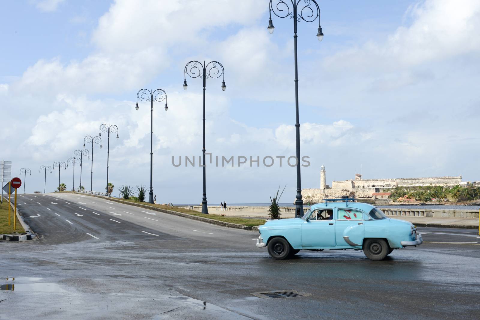 Havana, Cuba - 27 January 2016: Person driving his vintage car at the Malecon in Havana on Cuba