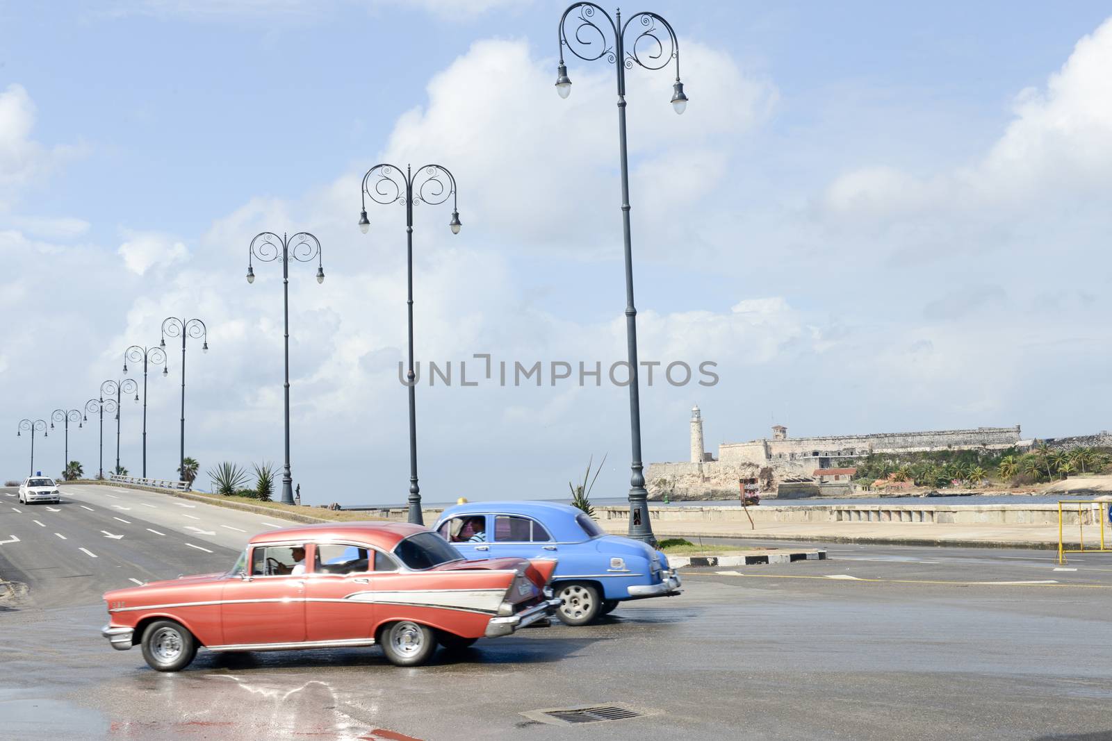  Person driving his vintage car at the Malecon in Havana by Fotoember