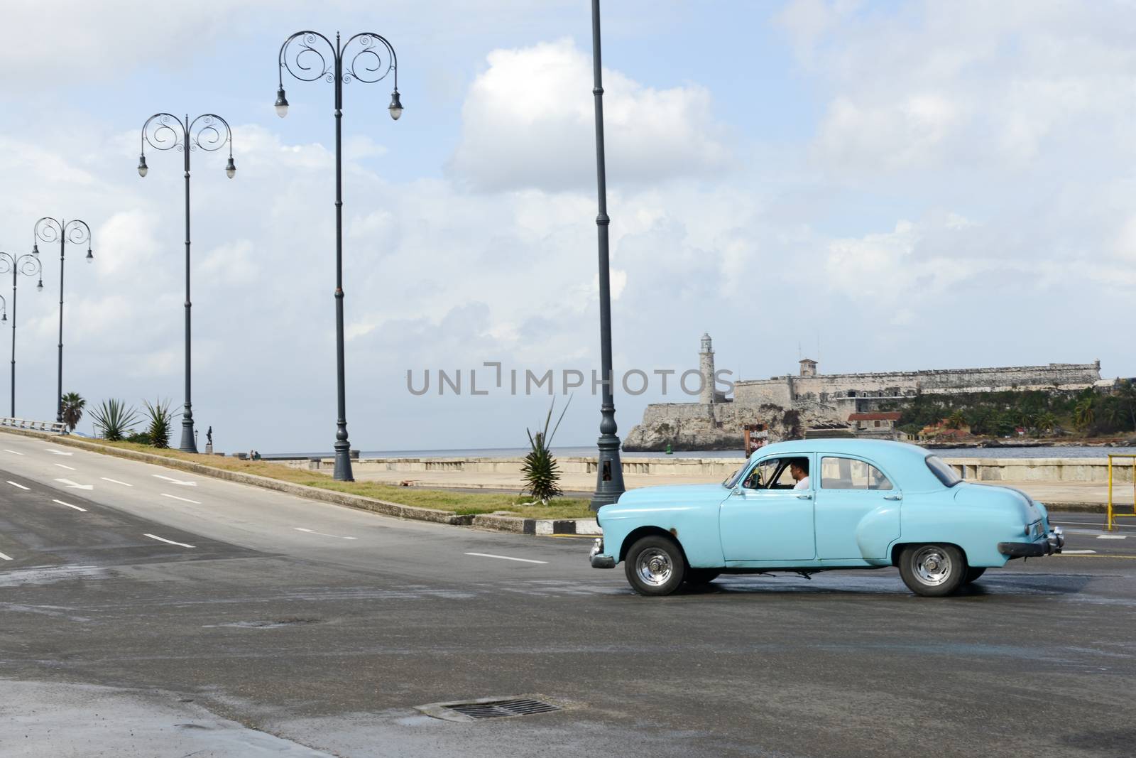  Person driving his vintage car at the Malecon in Havana by Fotoember