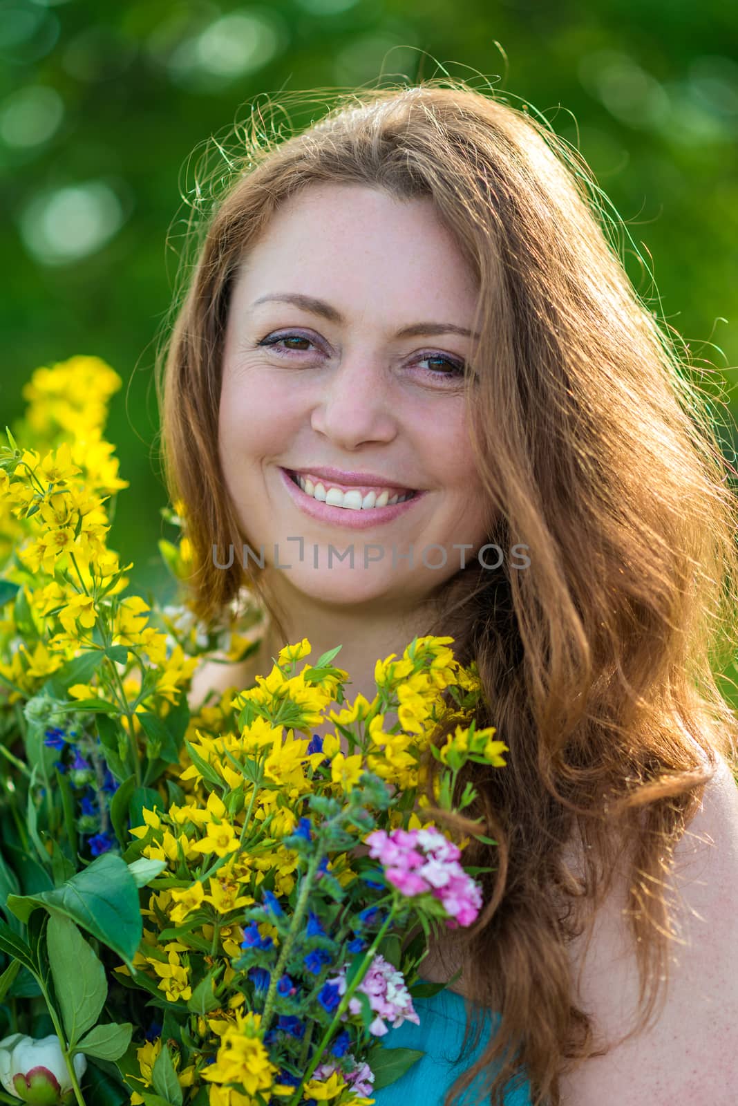 Portrait of a smiling girl with flowers