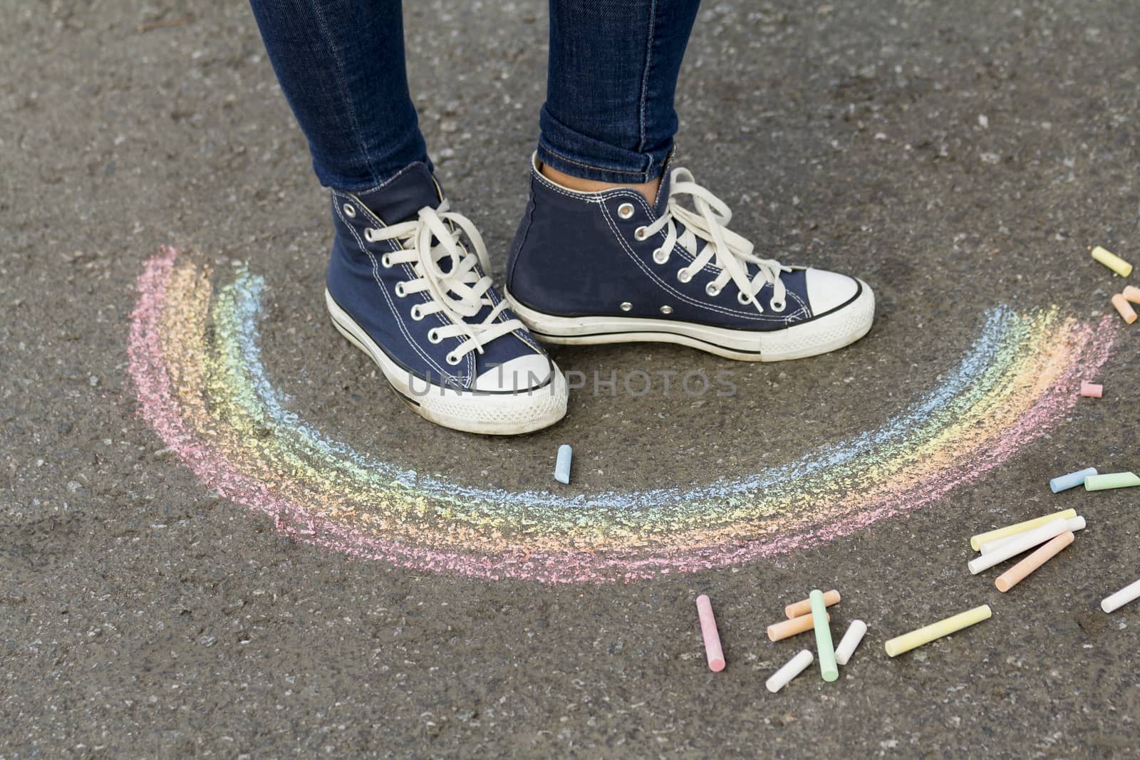 Legs in sneakers near the picture with a rainbow by sergeizubkov64