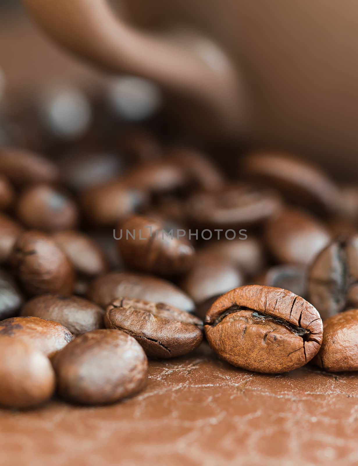 Close up roasted coffee beans and coffee cup