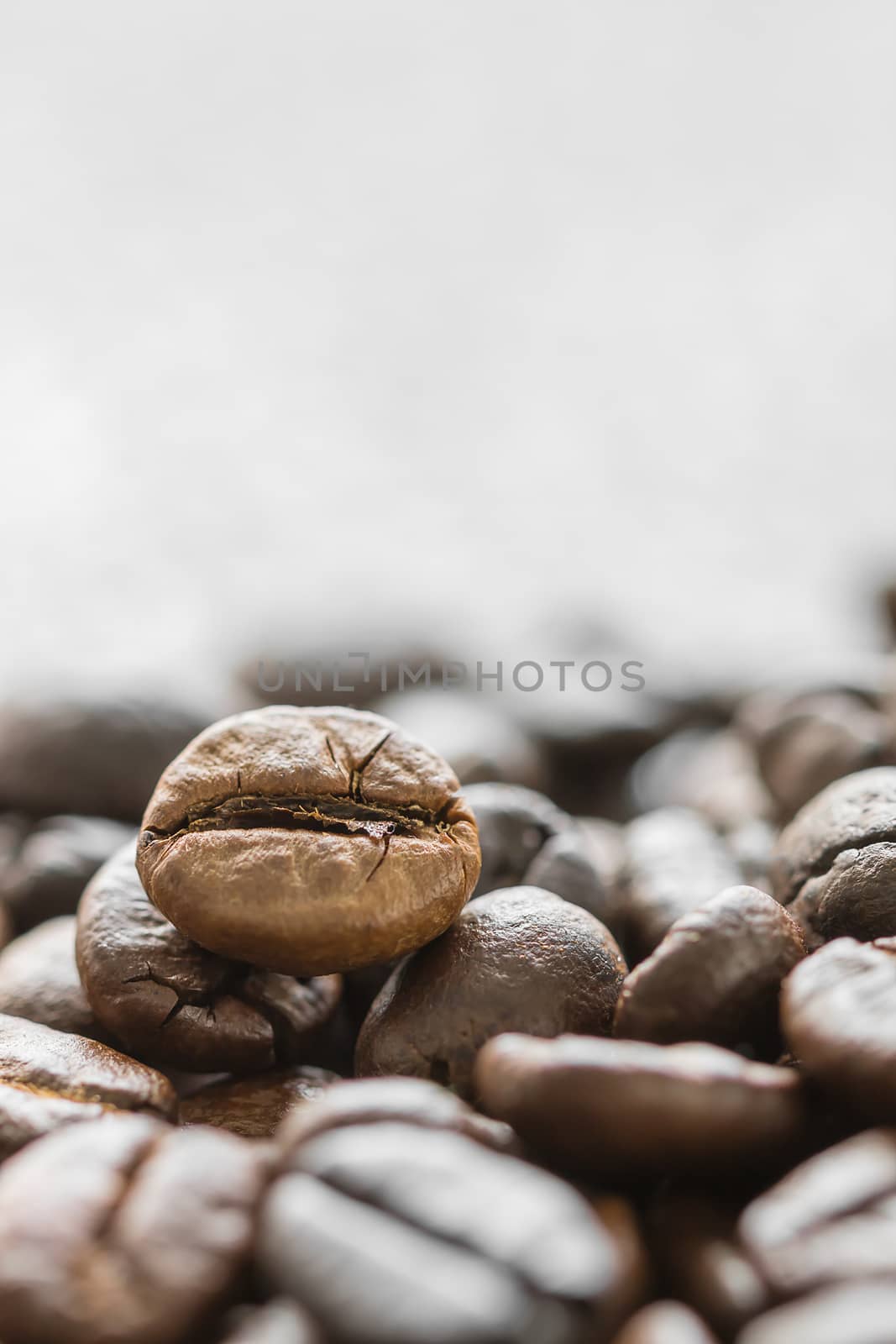 Close up heap of roasted brown coffee beans