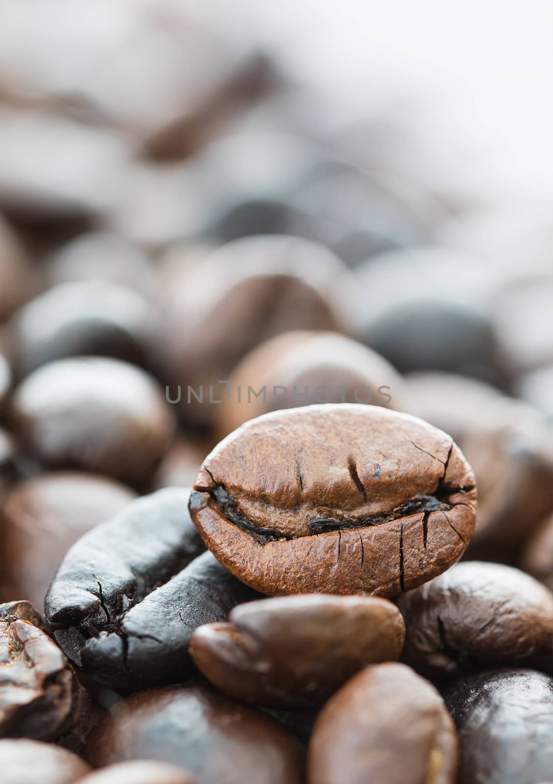 Close up heap of roasted brown coffee beans