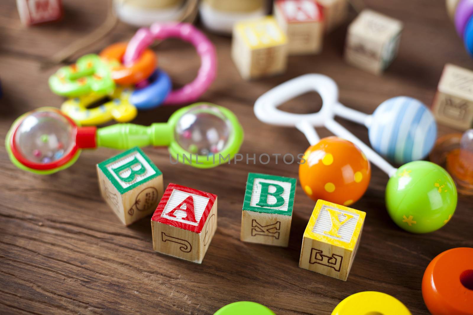 Children's World toy on a wooden background. Studio shot]