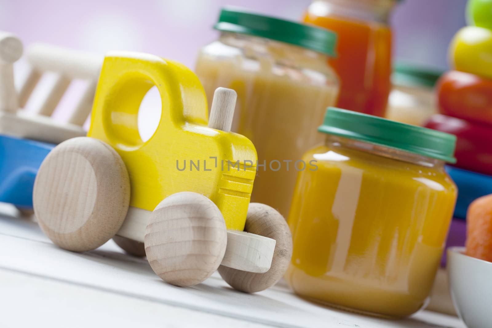 healthy ready-made baby food on a wooden table.