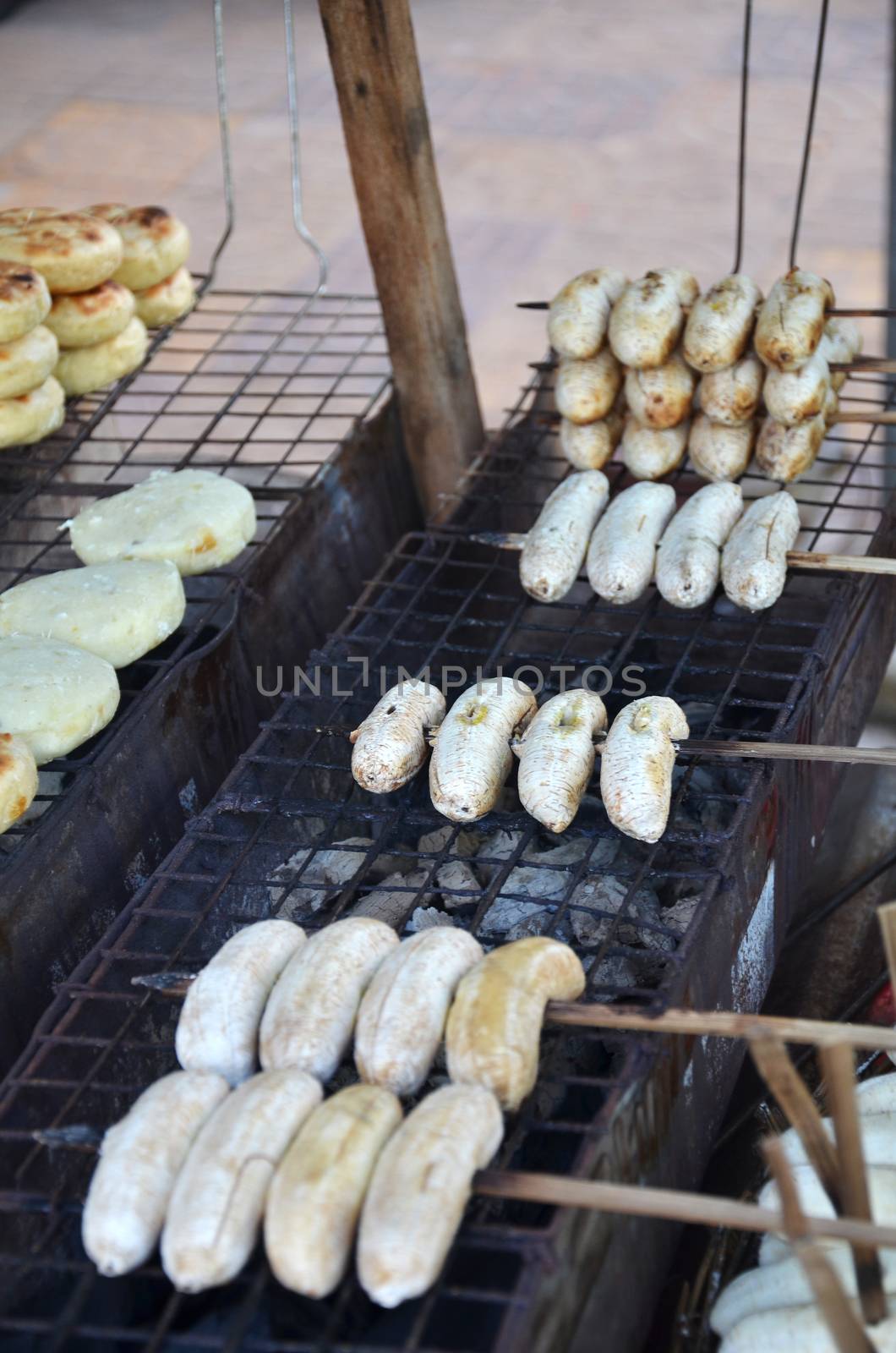 Sweet grilled bananas at asian food market in Cambodia