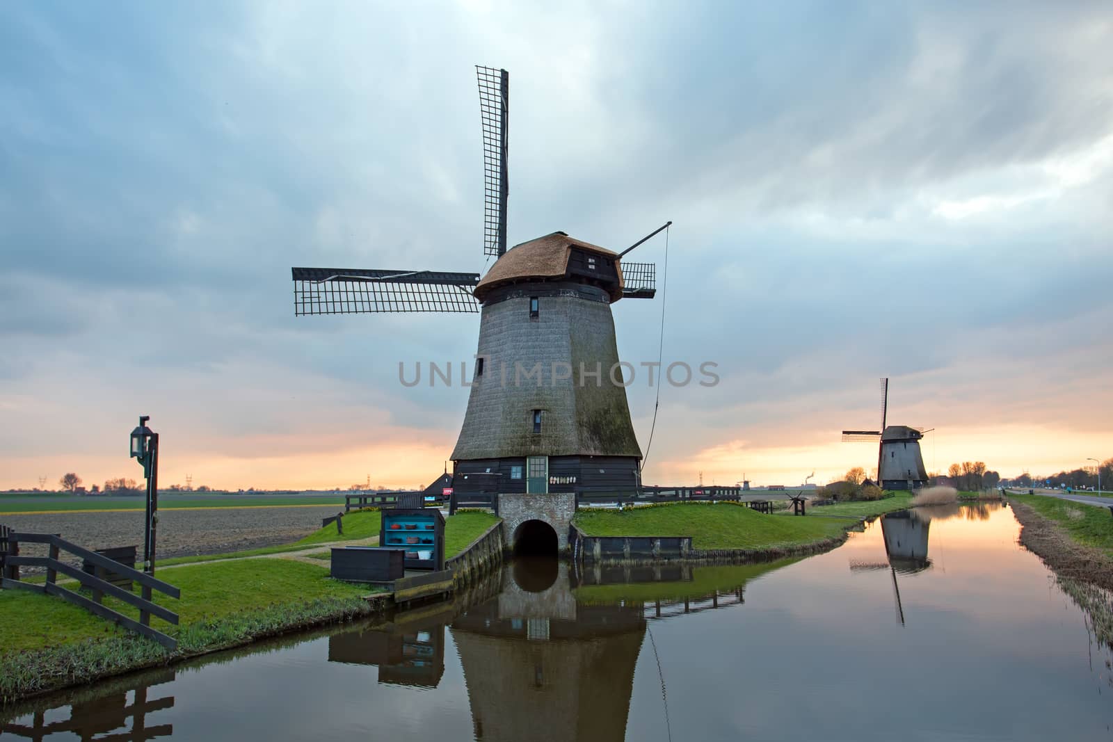 Medieval windmills in the countryside from the Netherlands at twilight
