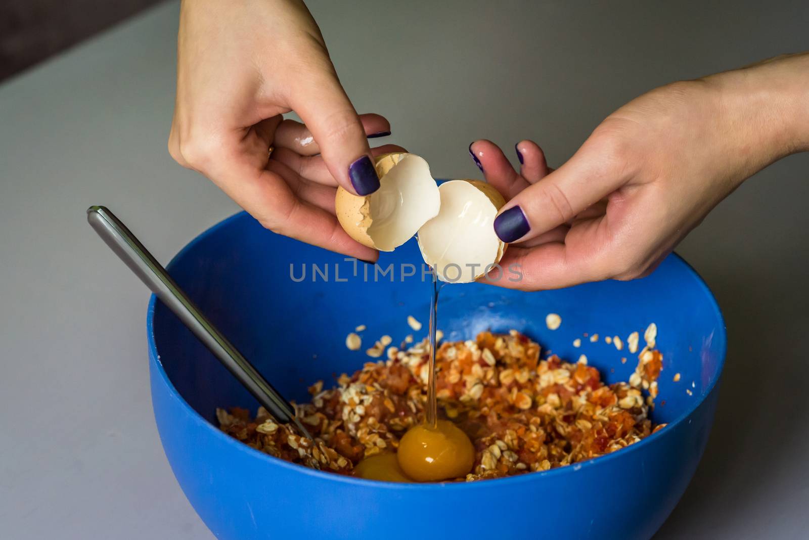 hand poured down raw egg with shell by okskukuruza
