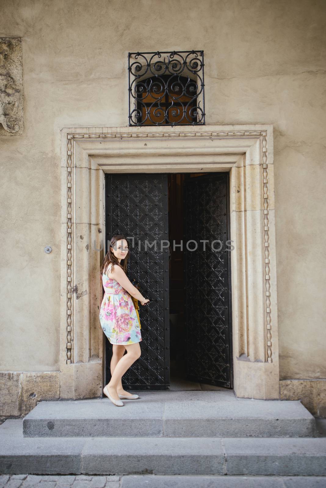 Beautiful girl during sightseeing old castle in Cracow, Wawel. by Brejeq