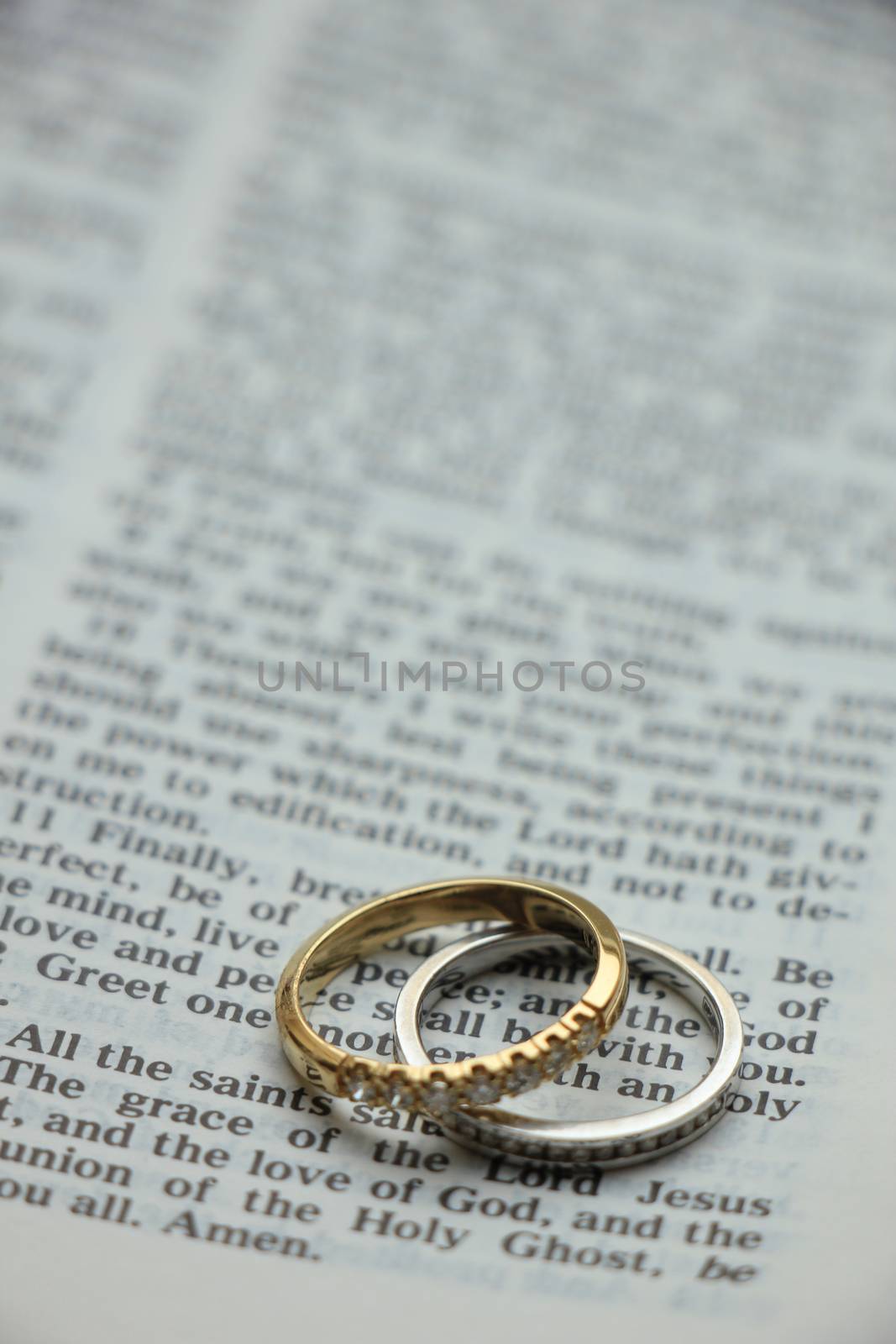 Two diamond wedding bands for a double bride wedding, on a bible verse